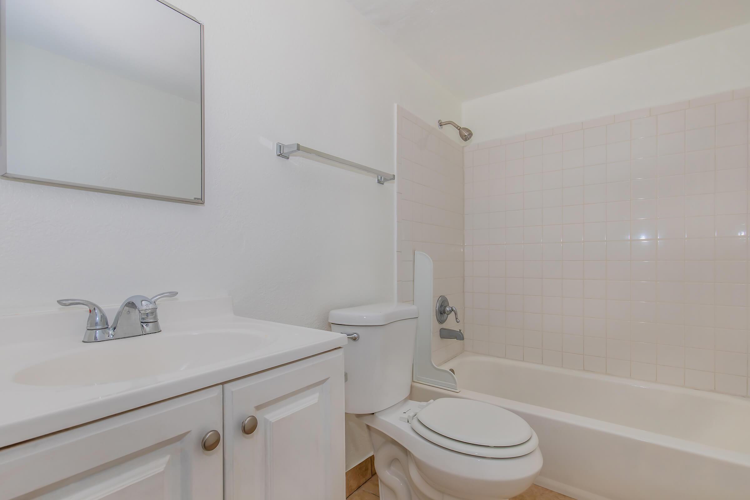 a room with a sink and a shower