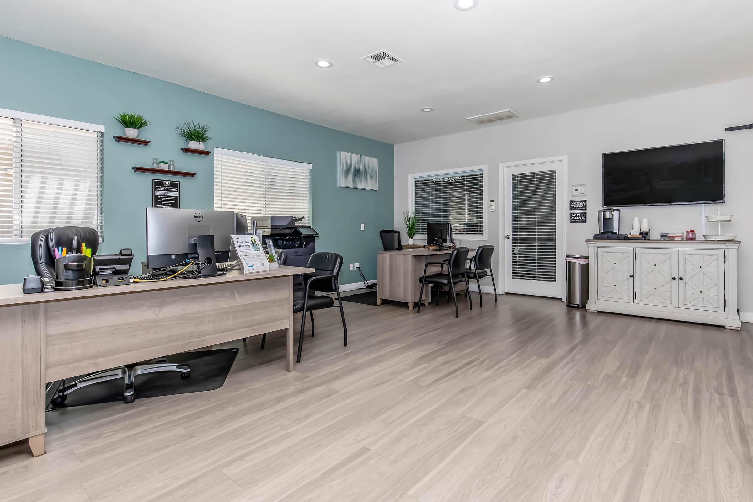 a room filled with furniture and a wood floor