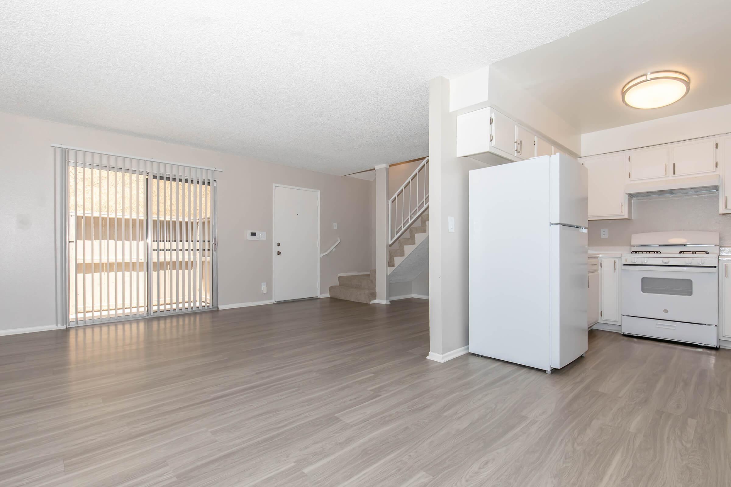 a kitchen with a wood floor