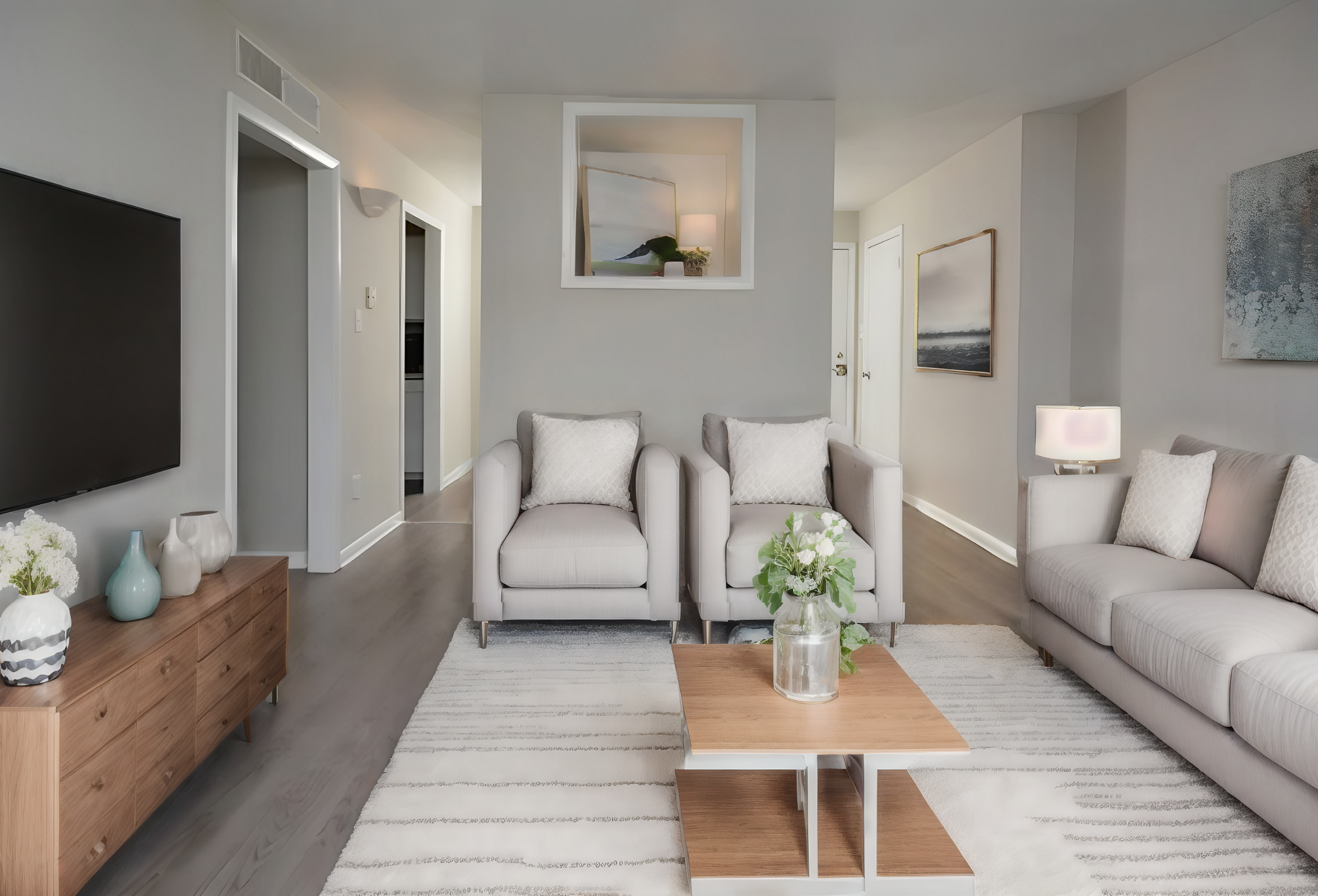 a living room filled with furniture and a large mirror