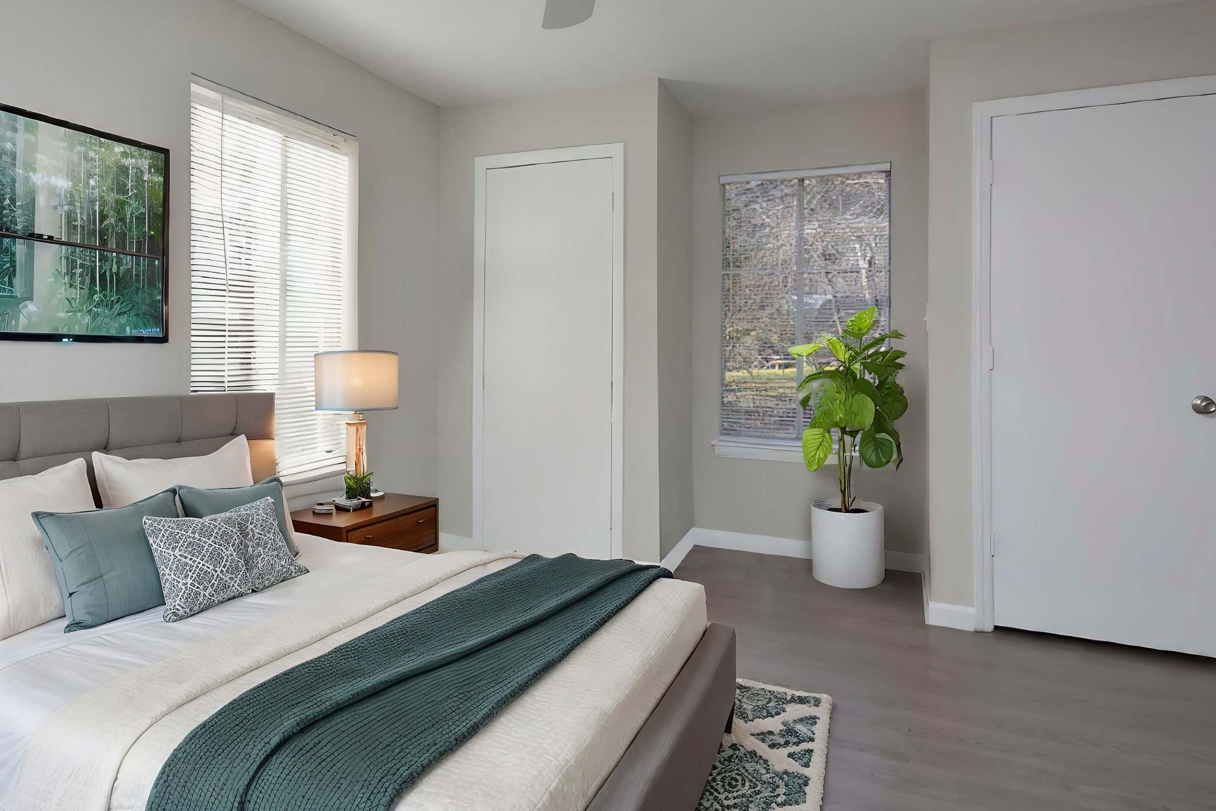 a living room filled with furniture and a large window