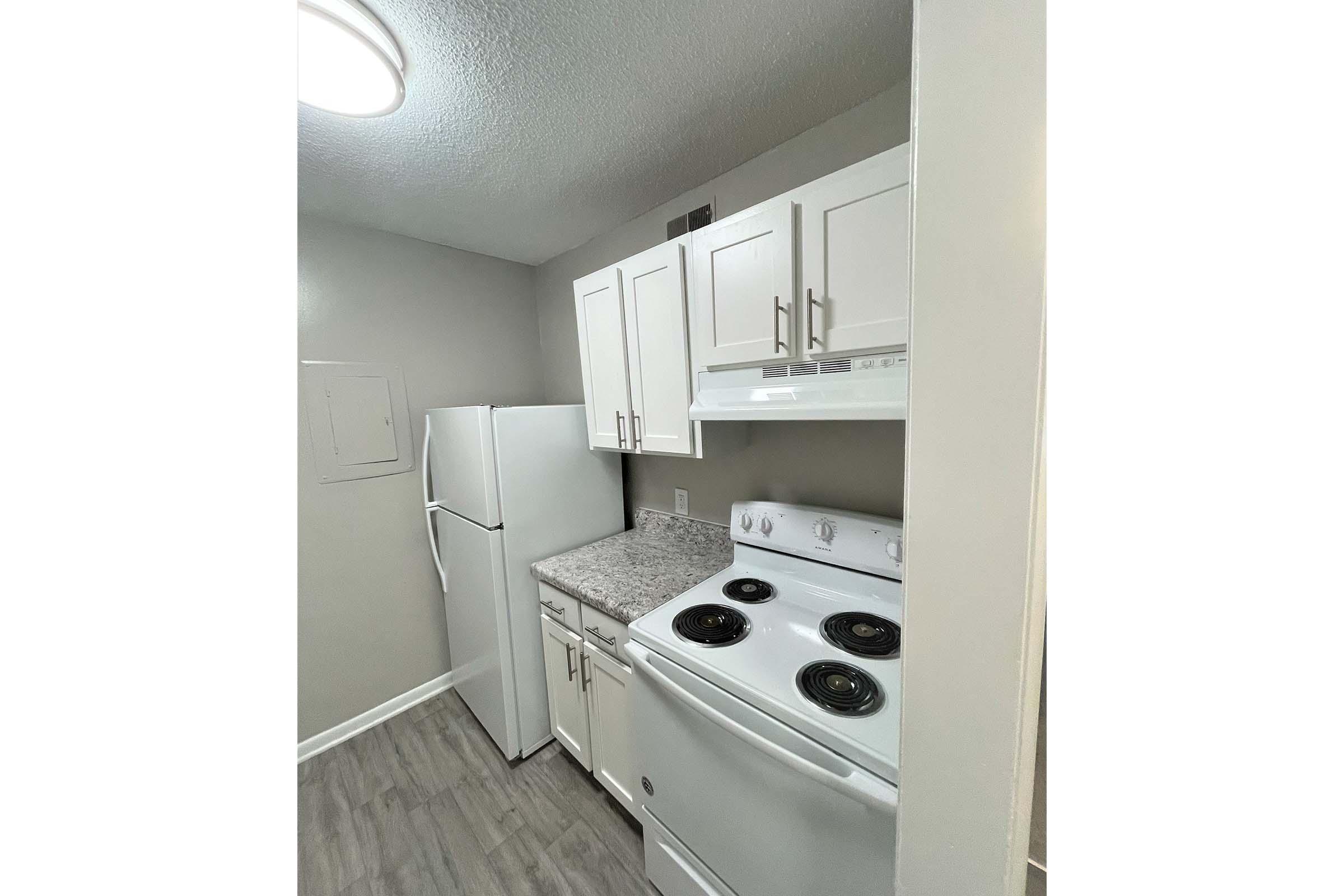 a kitchen with a stove and a sink