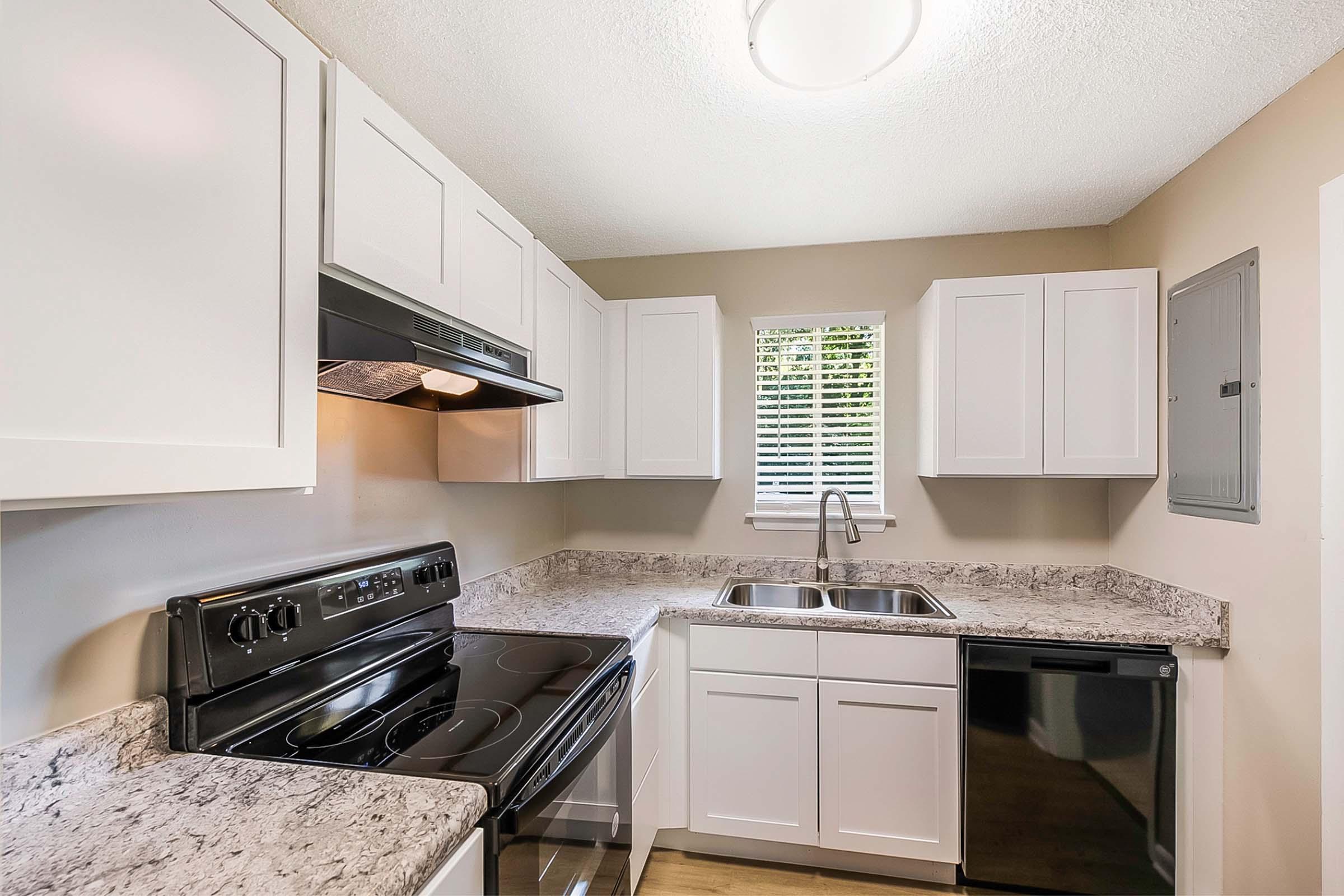 a kitchen with a stove top oven