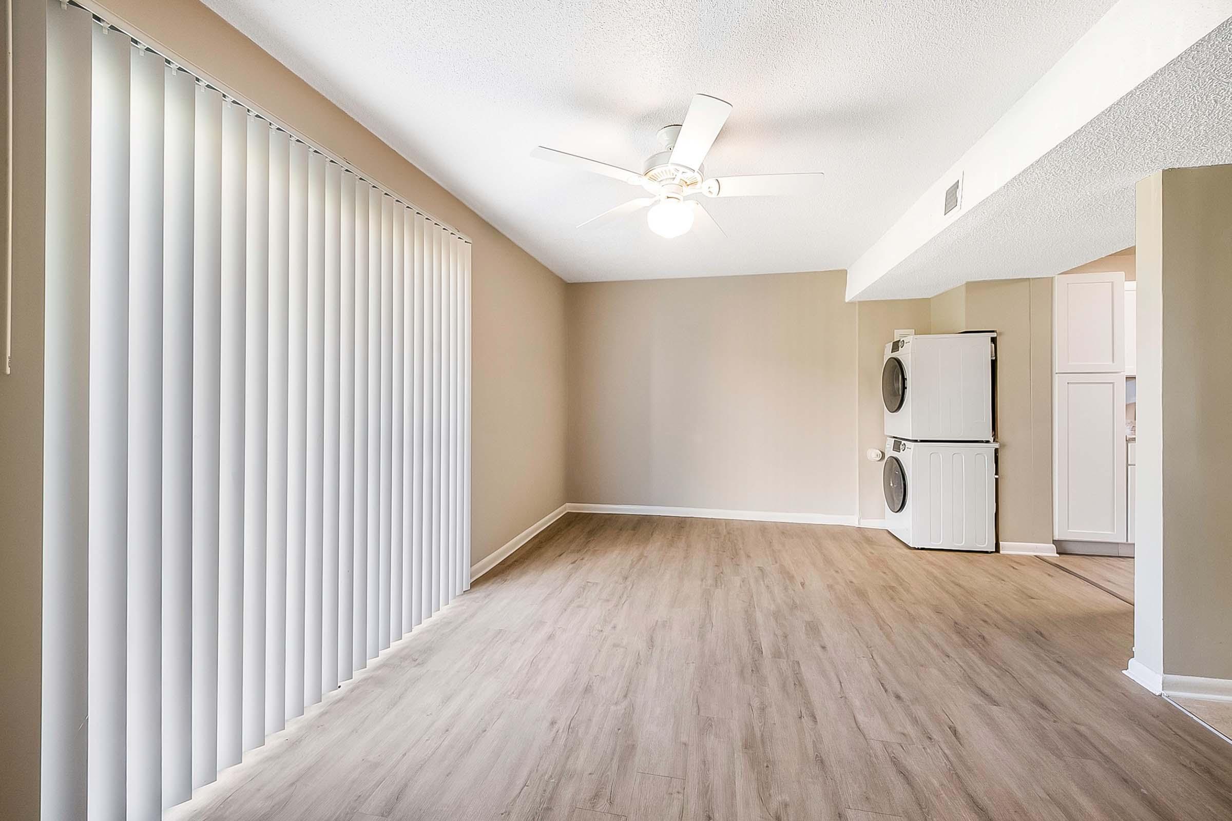 a bedroom with a wooden floor