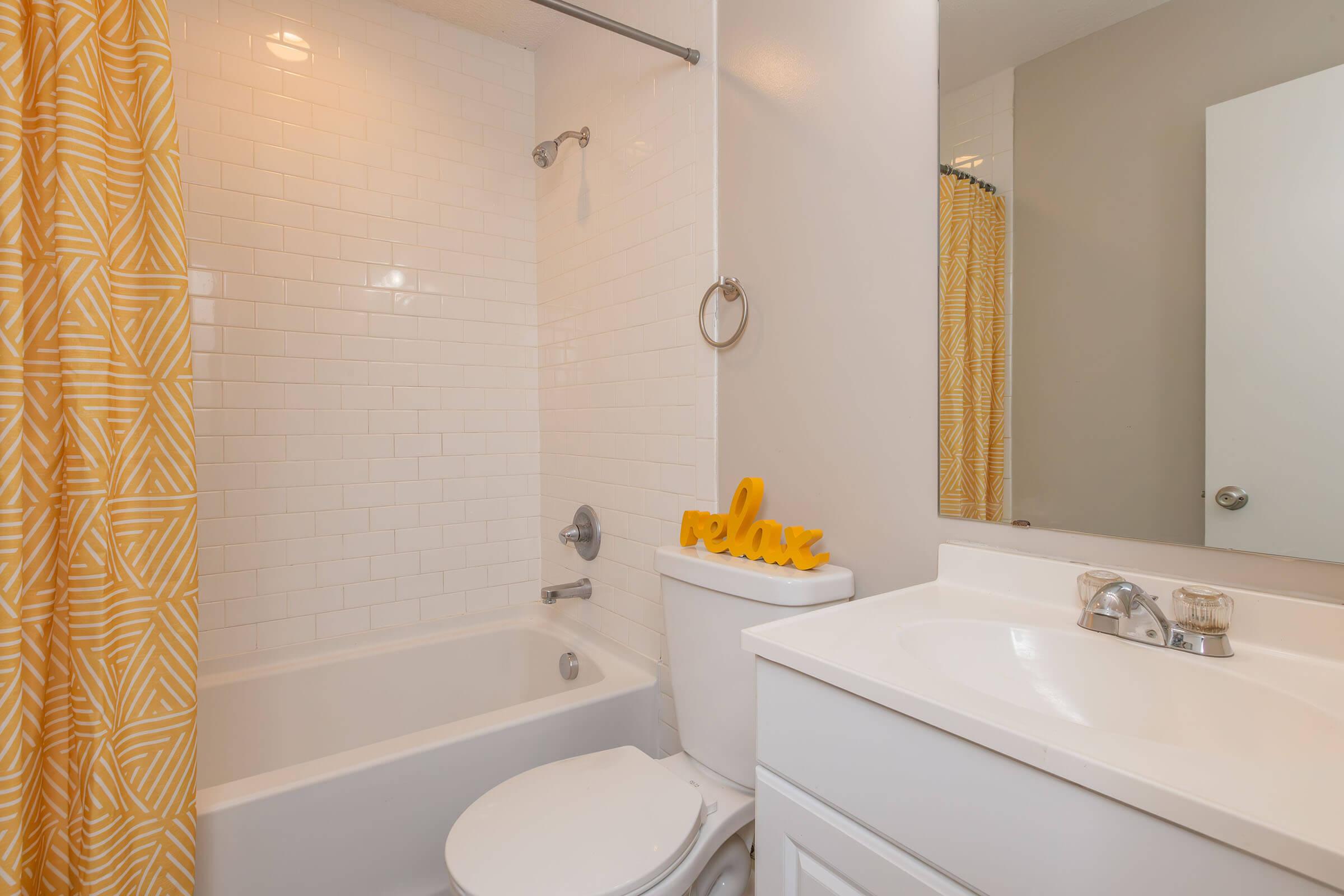 a shower that has a sink and a mirror