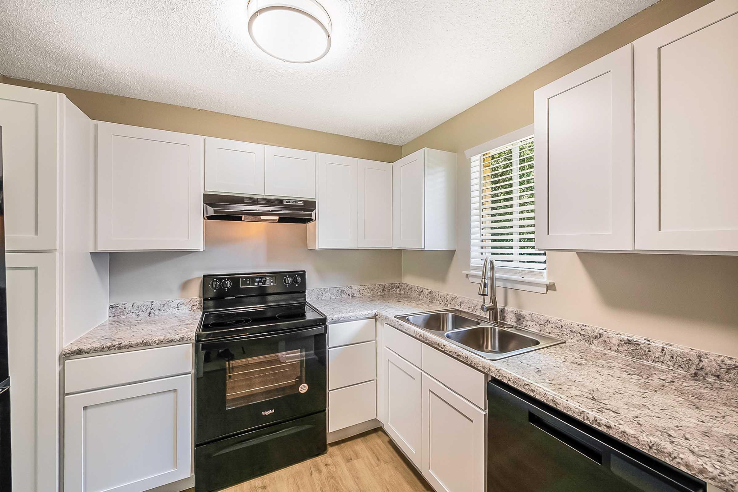 a kitchen with a stove top oven