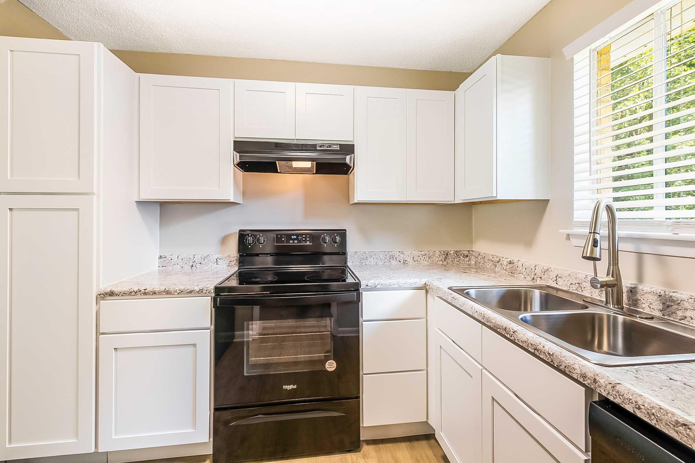 a kitchen with a stove top oven