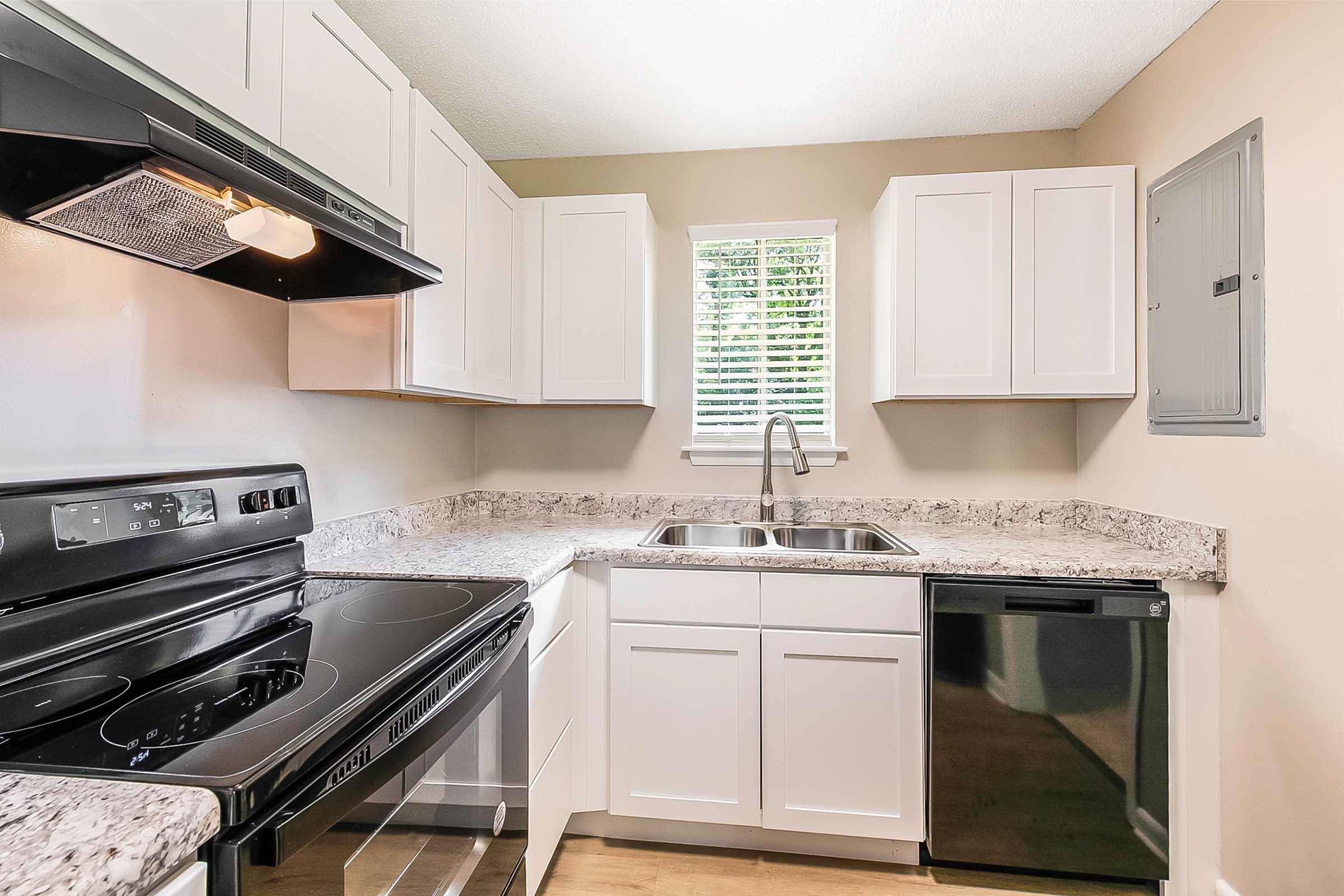 a kitchen with a stove top oven