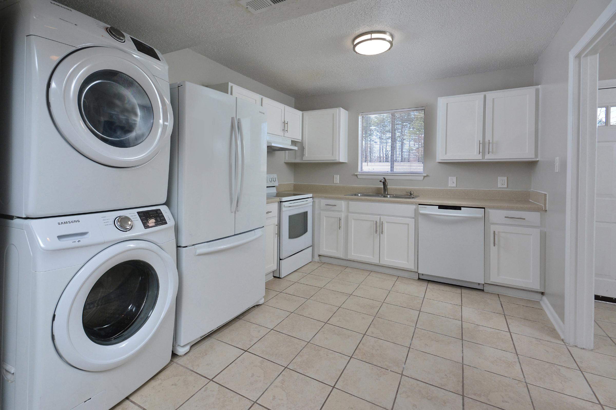 a kitchen with a sink and a microwave