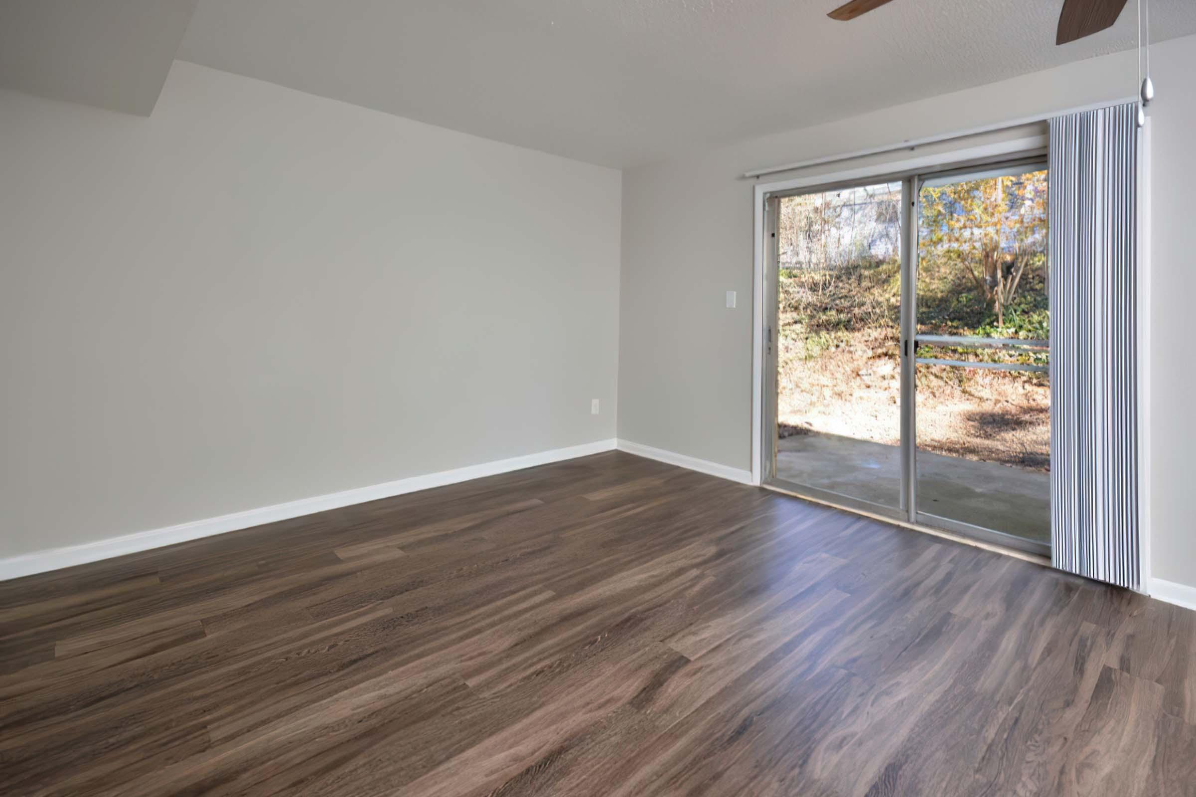 a large empty room with a wood floor