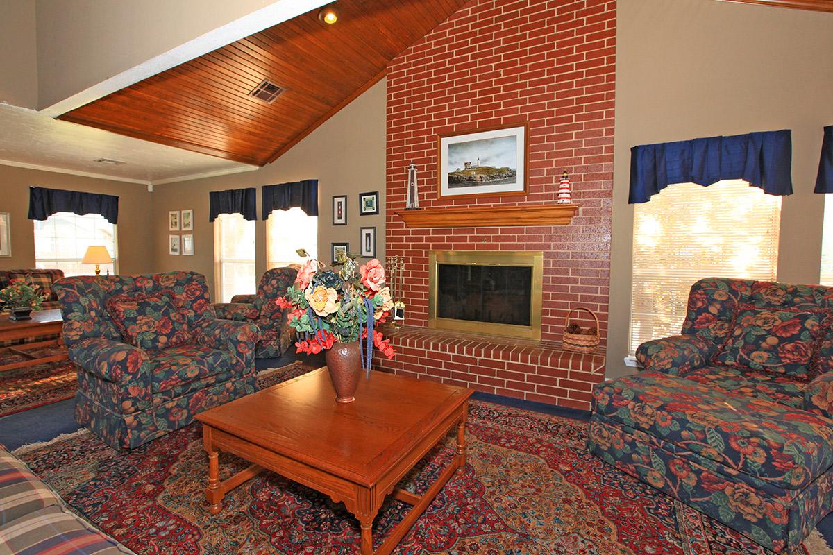 a living room filled with furniture and a fire place