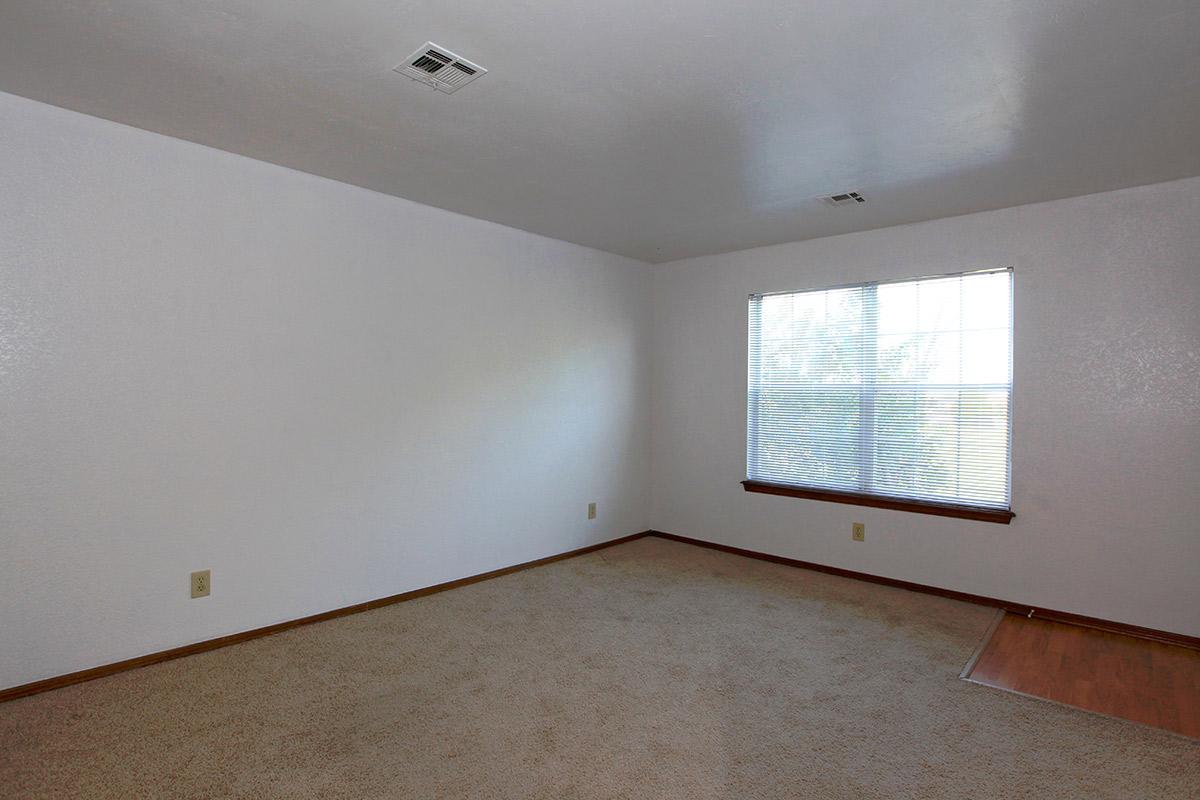 a bedroom with a large window