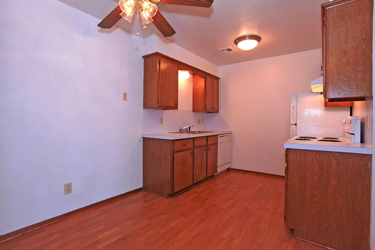 a kitchen with a wood floor