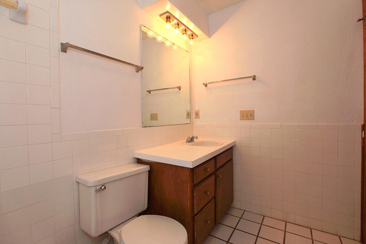 a white sink in a small room