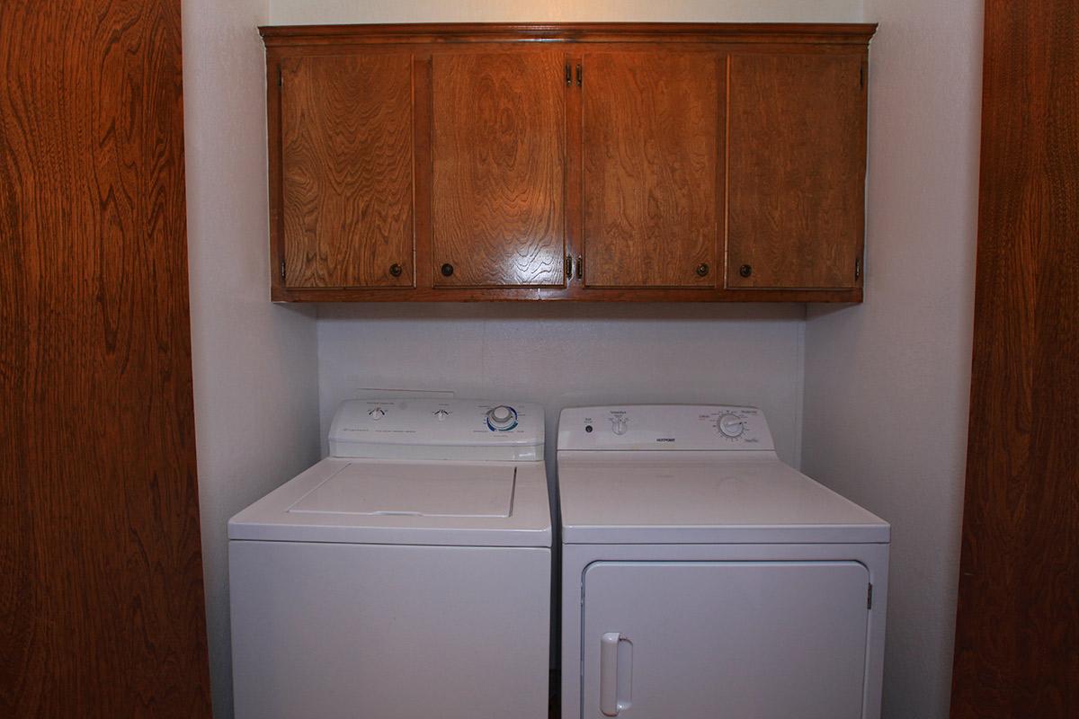 a white refrigerator freezer sitting inside of a kitchen