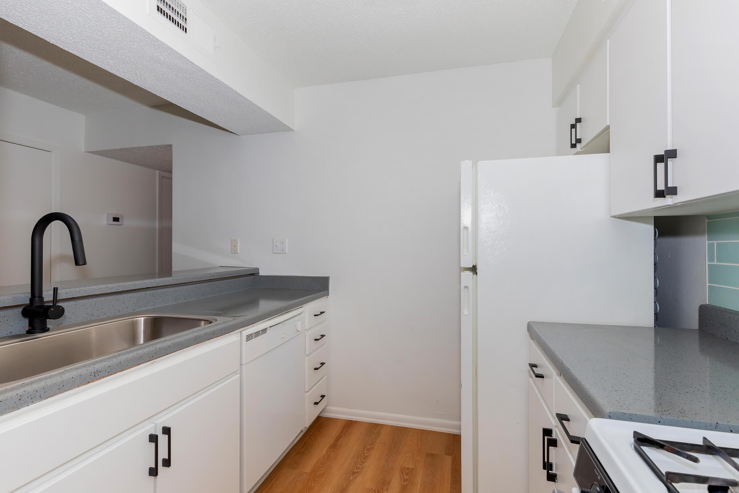 a kitchen with a stove and a sink