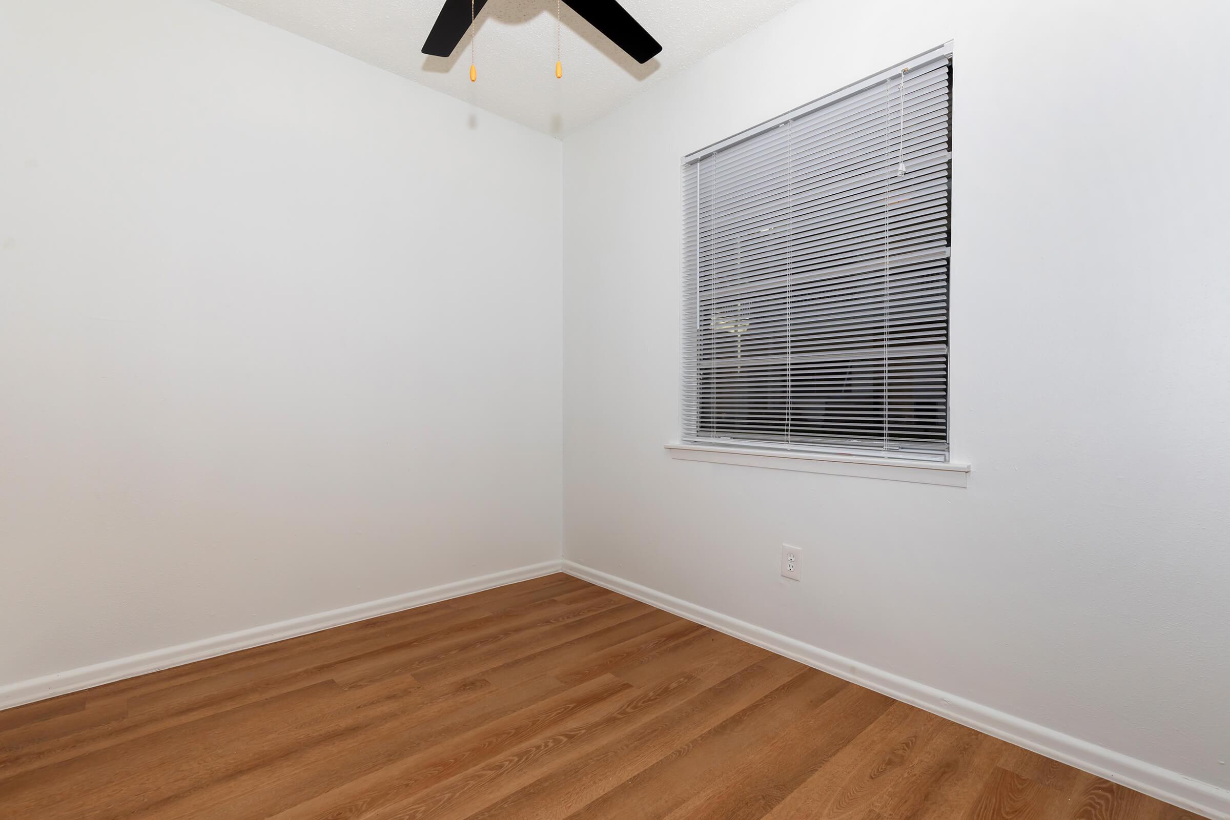 a bedroom with a large window