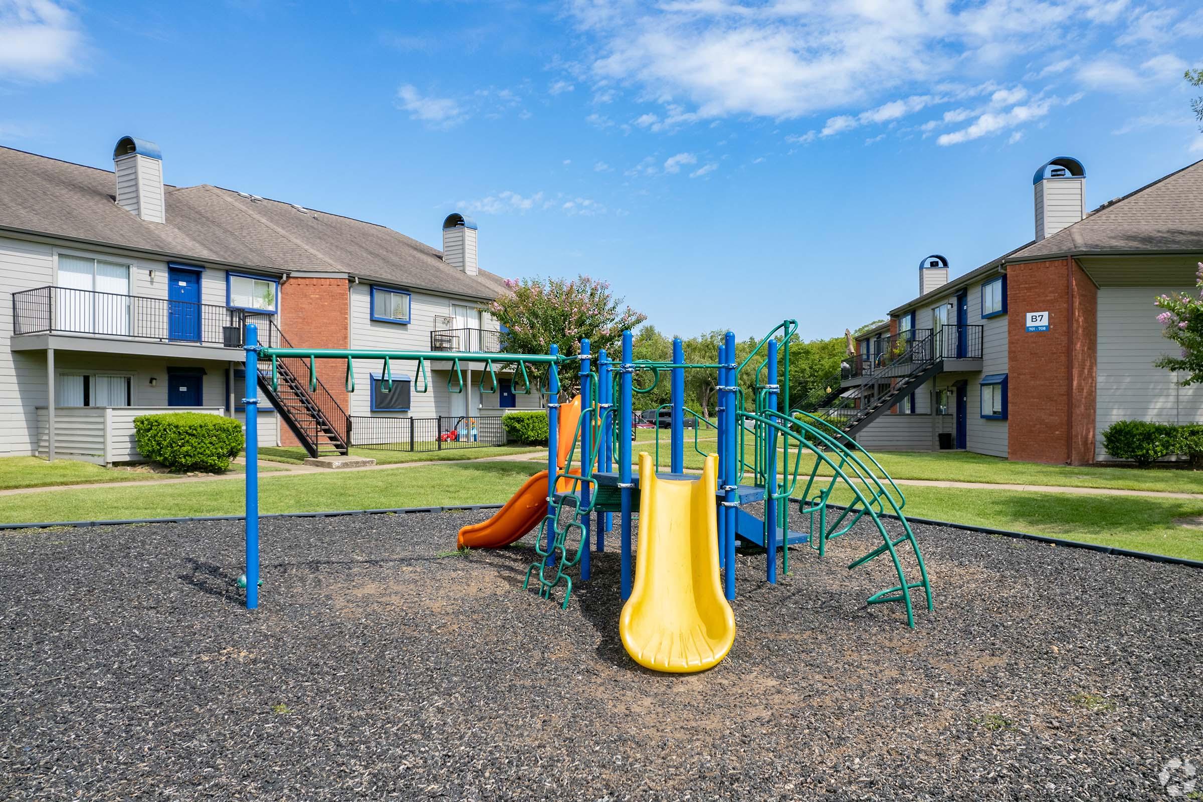 a playground in front of a house