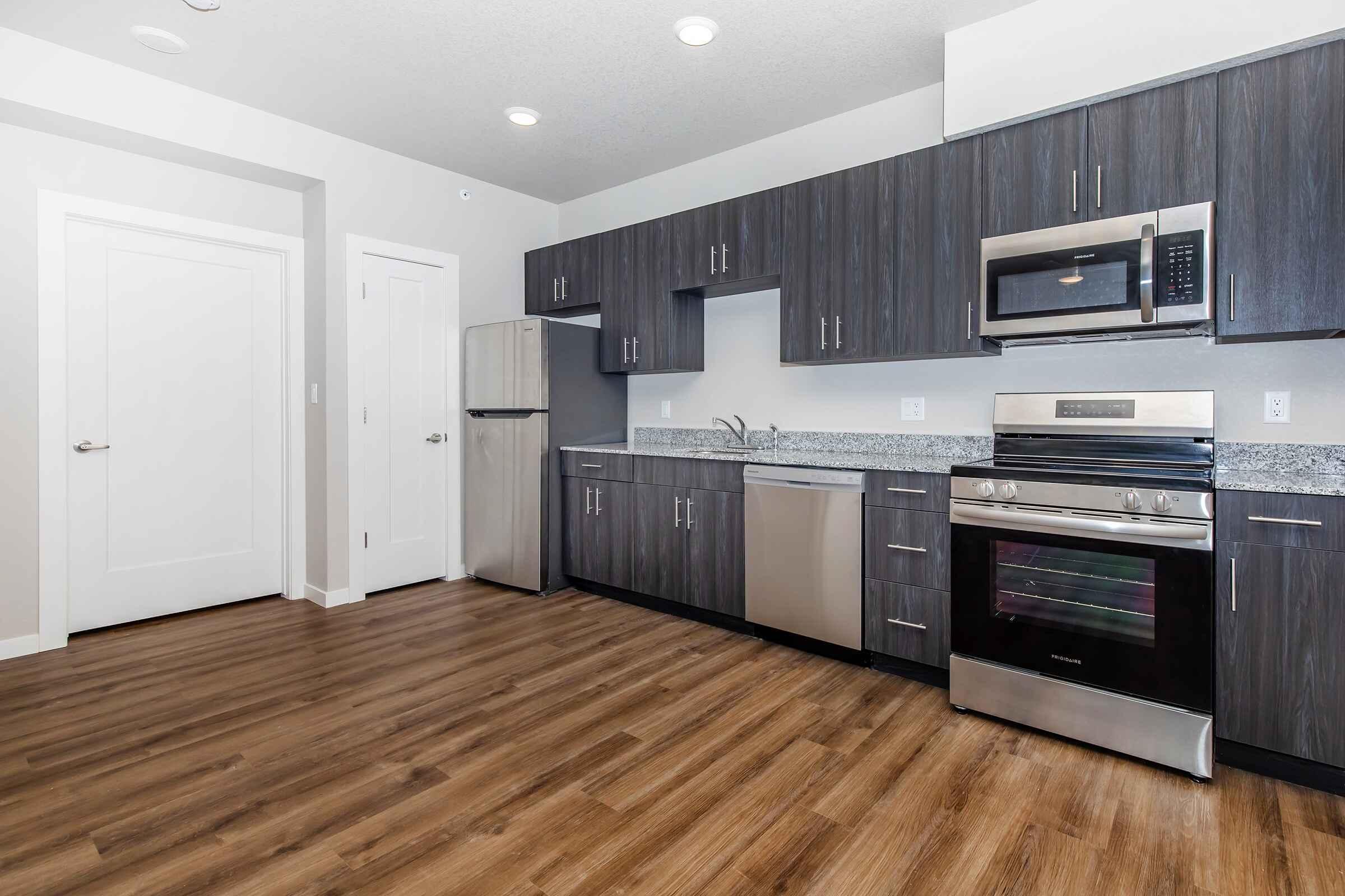 a kitchen with a wood floor