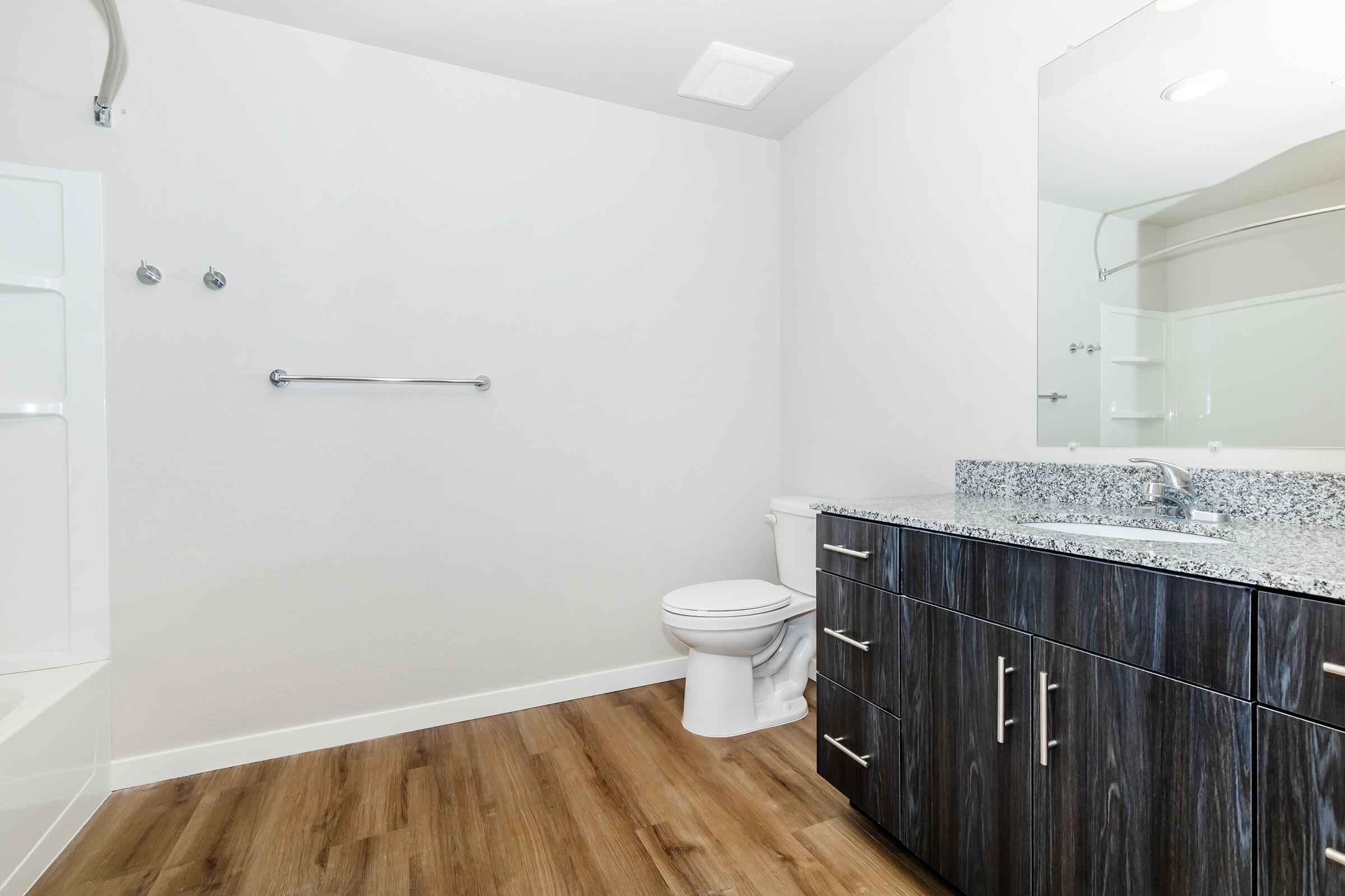 a kitchen with a sink and a mirror