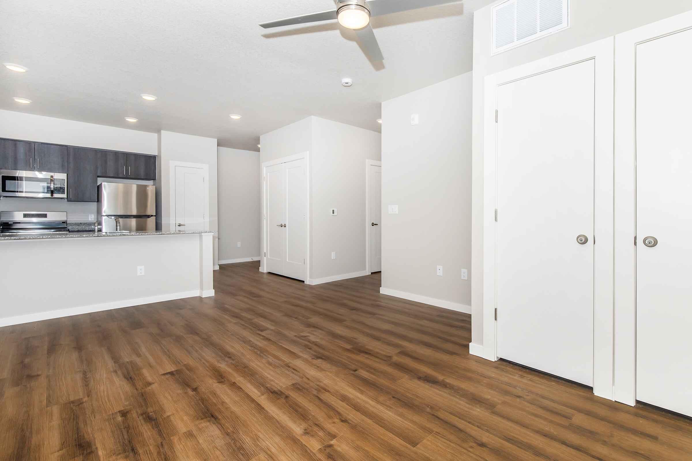 a kitchen with a wooden floor