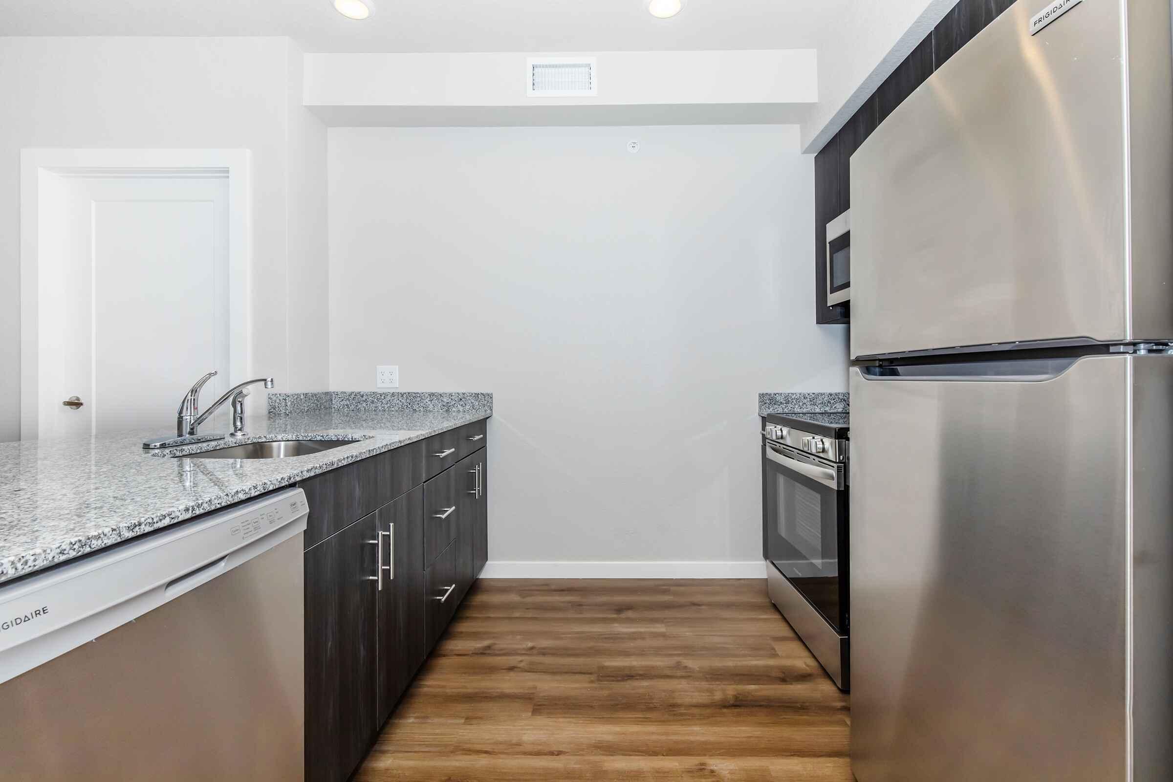 a stainless steel refrigerator in a kitchen