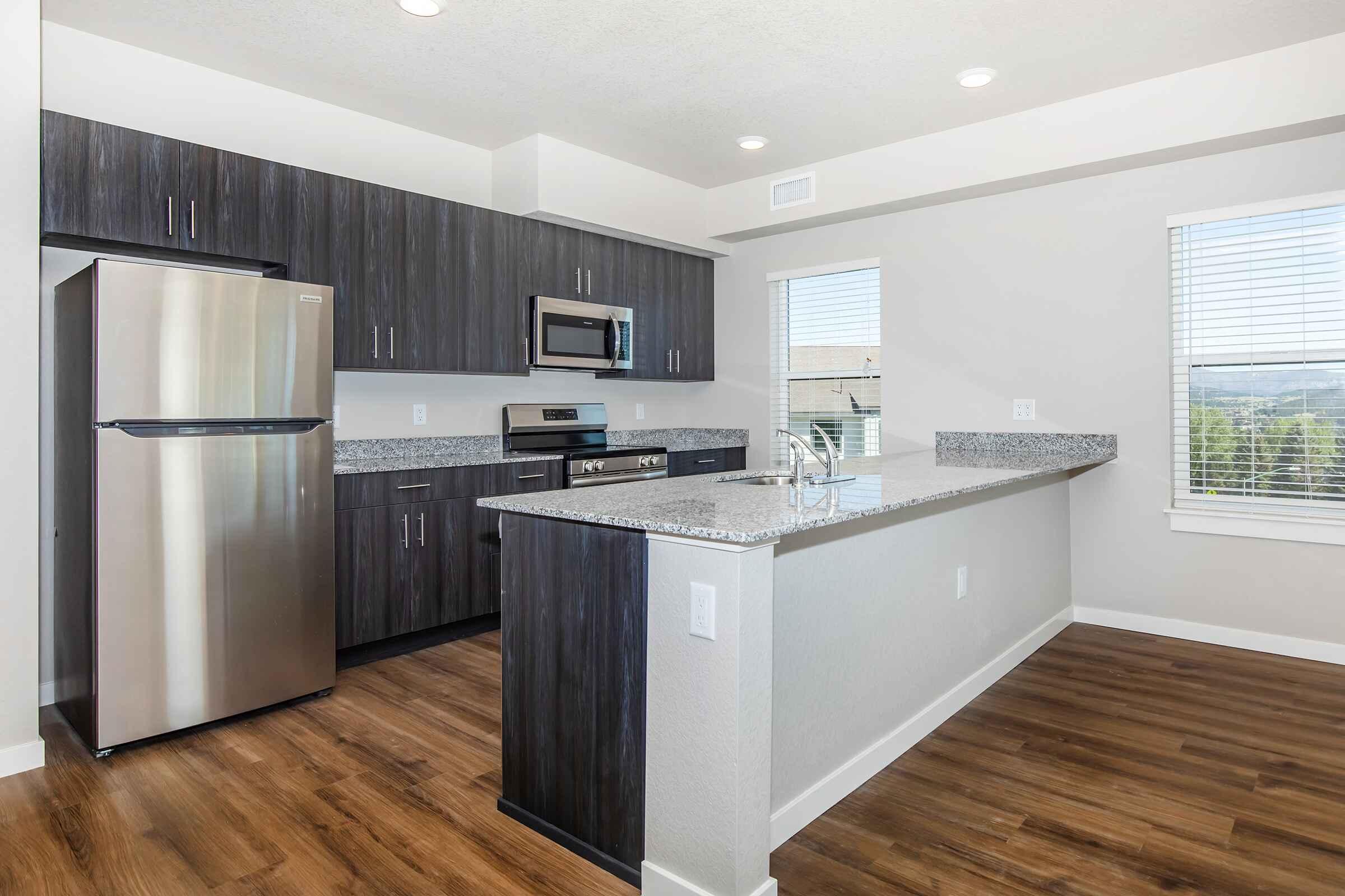 a kitchen with a wood floor