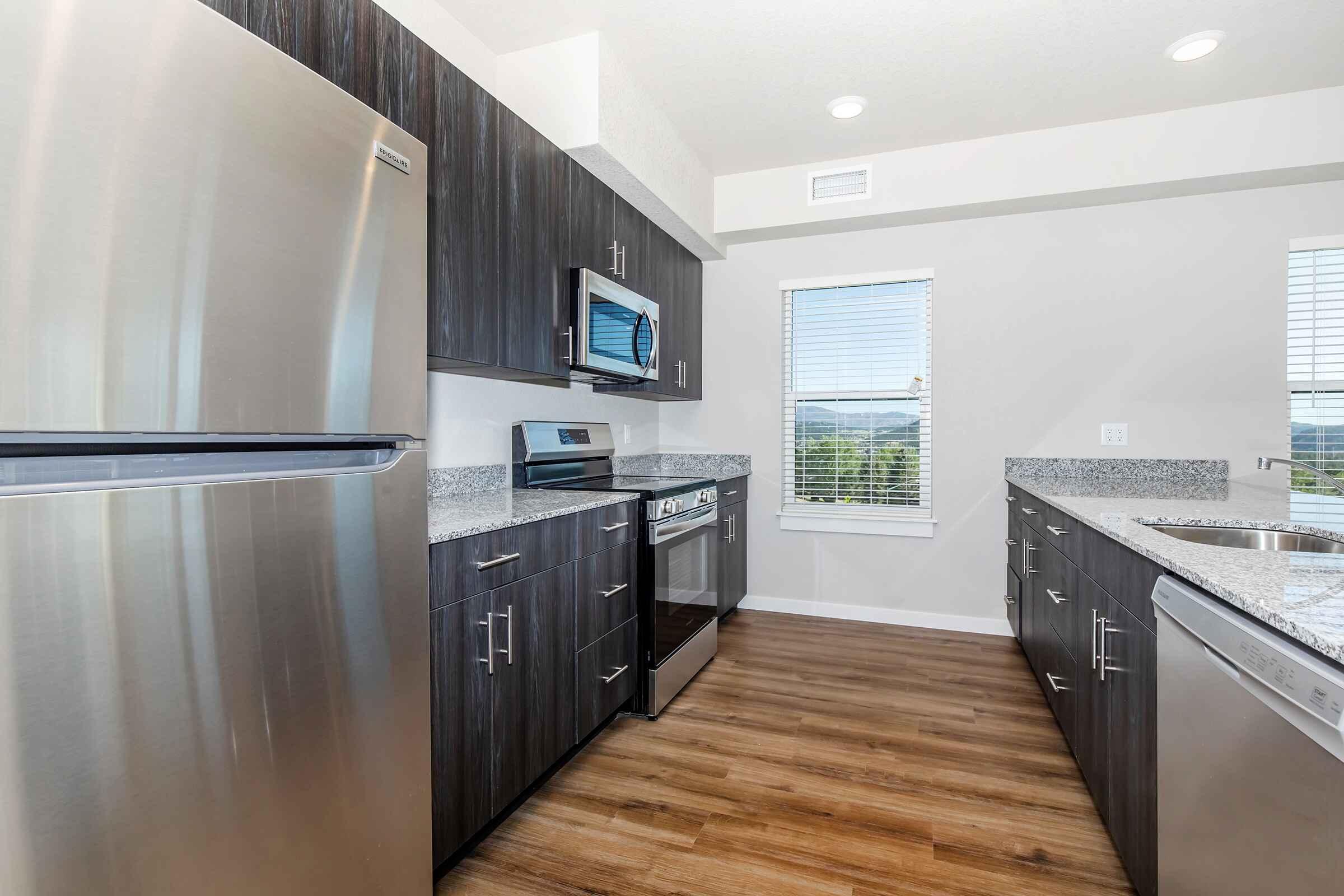 a stainless steel refrigerator in a kitchen