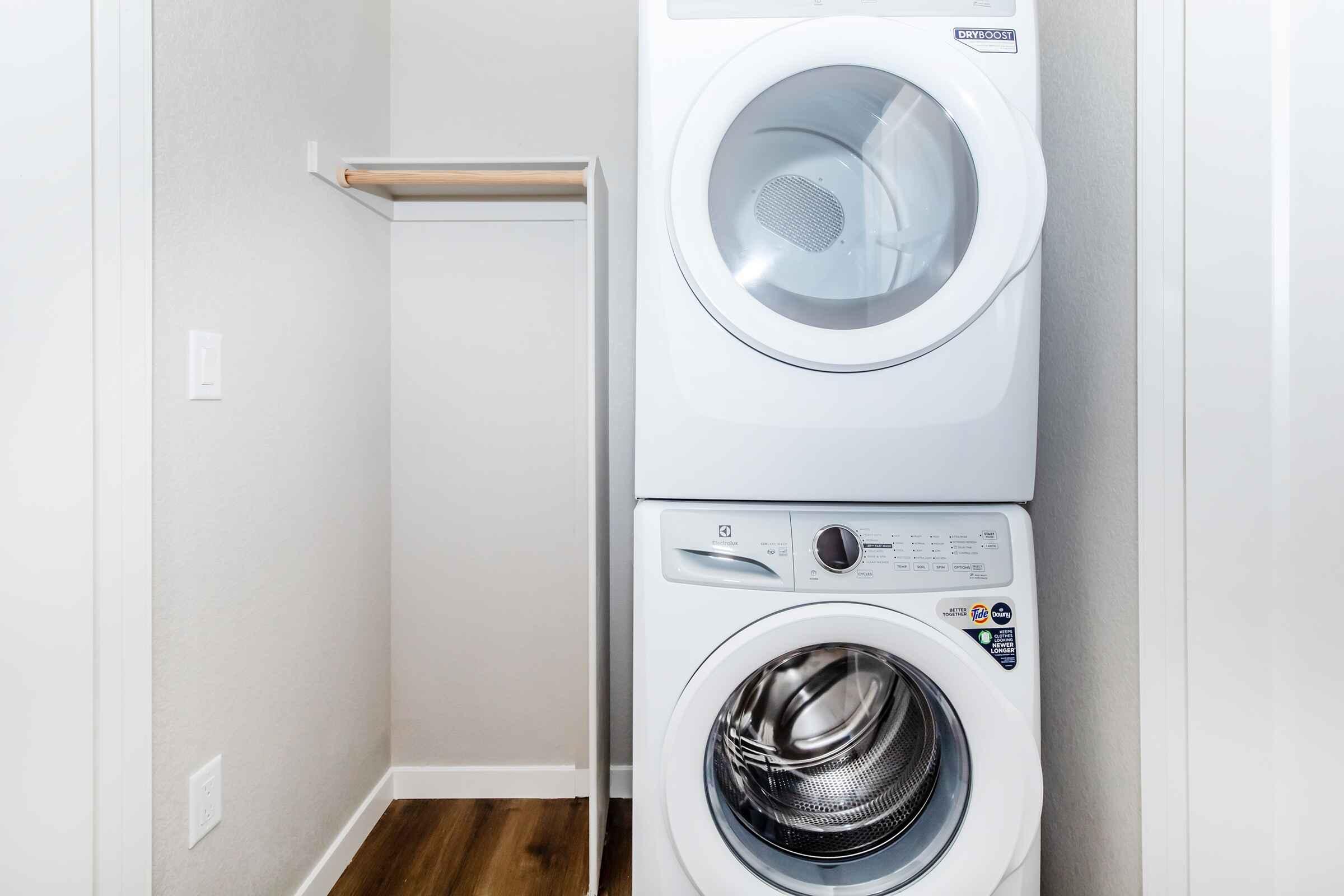 a microwave oven sitting on top of a refrigerator