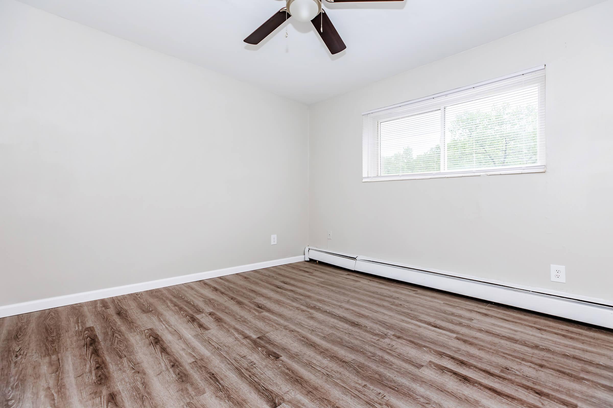 a bedroom with a large window