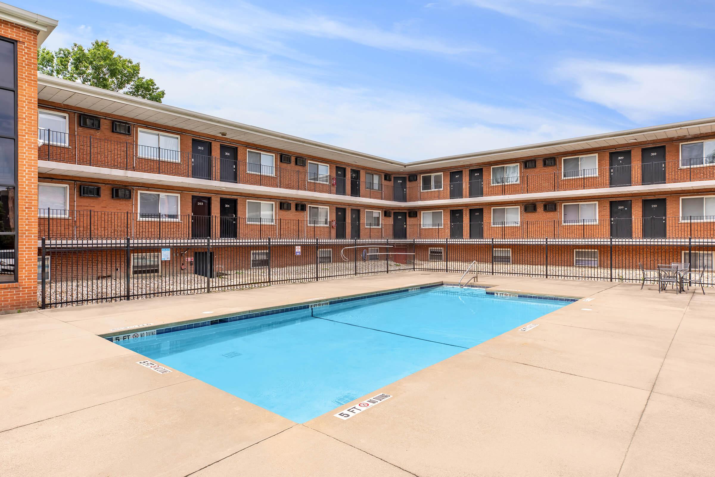 a pool in front of a building