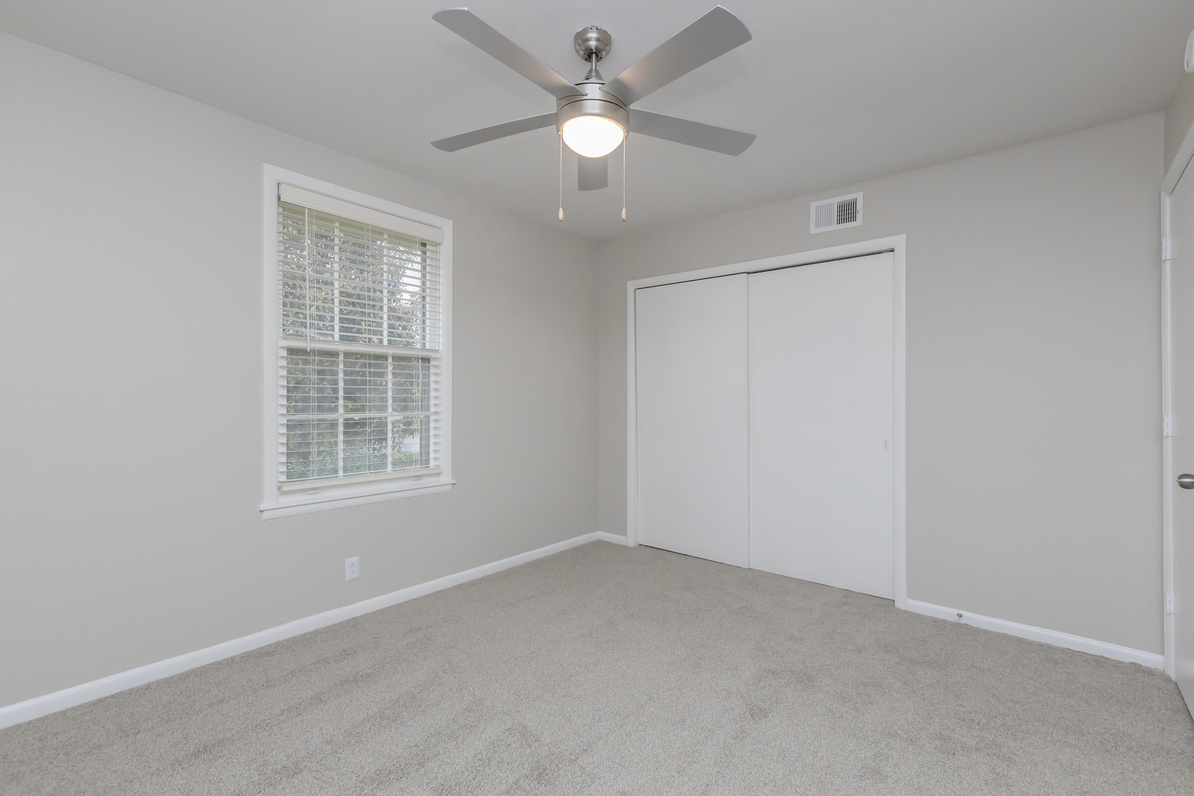 Bedroom with ceiling fan in Hermitage, TN apartment.