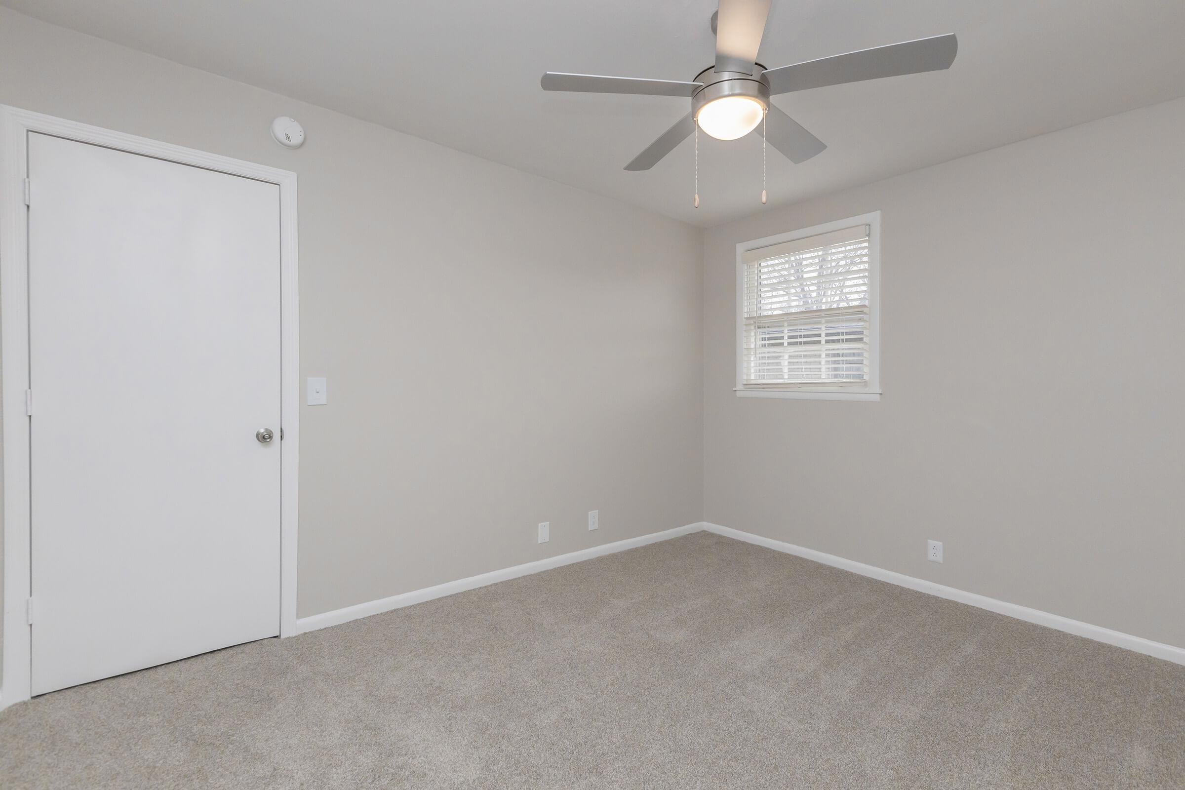 Carpeted bedroom.