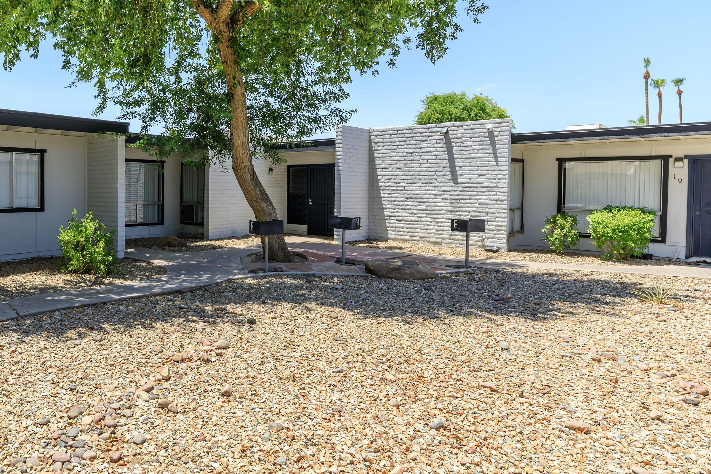 a house with trees in the background