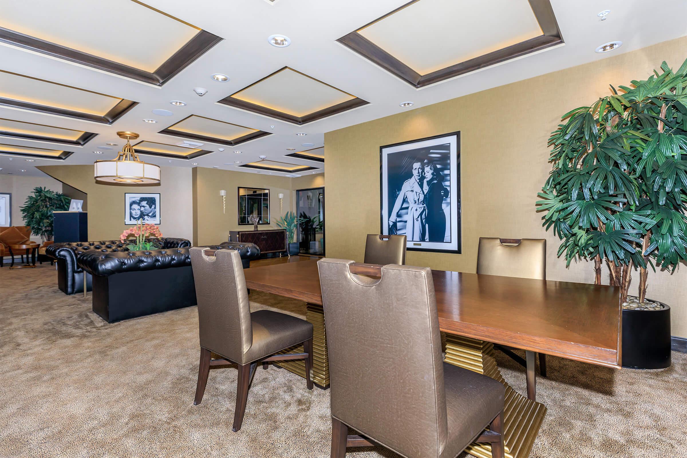 a living room filled with furniture and a table