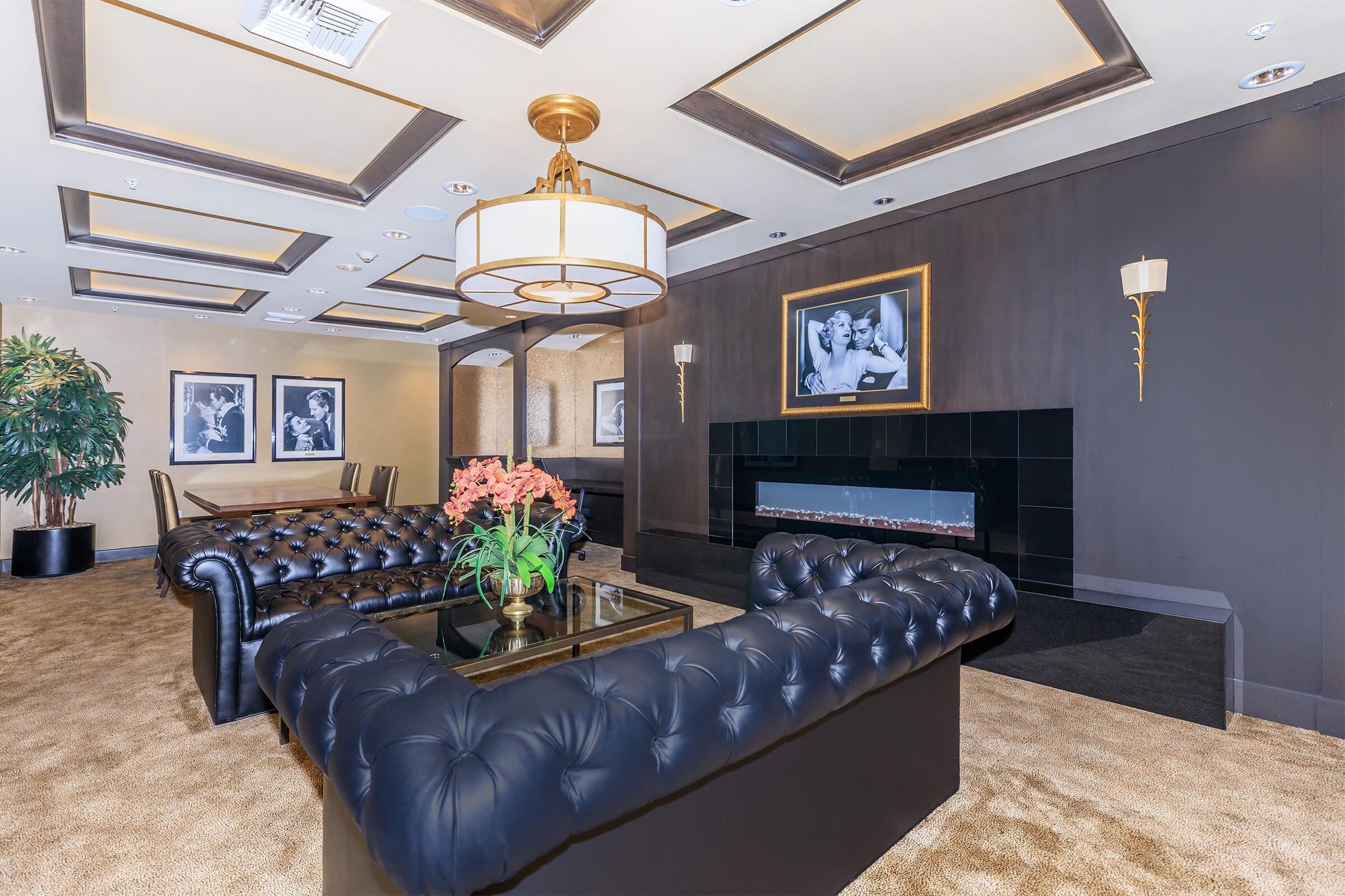 a living room filled with furniture and a tv