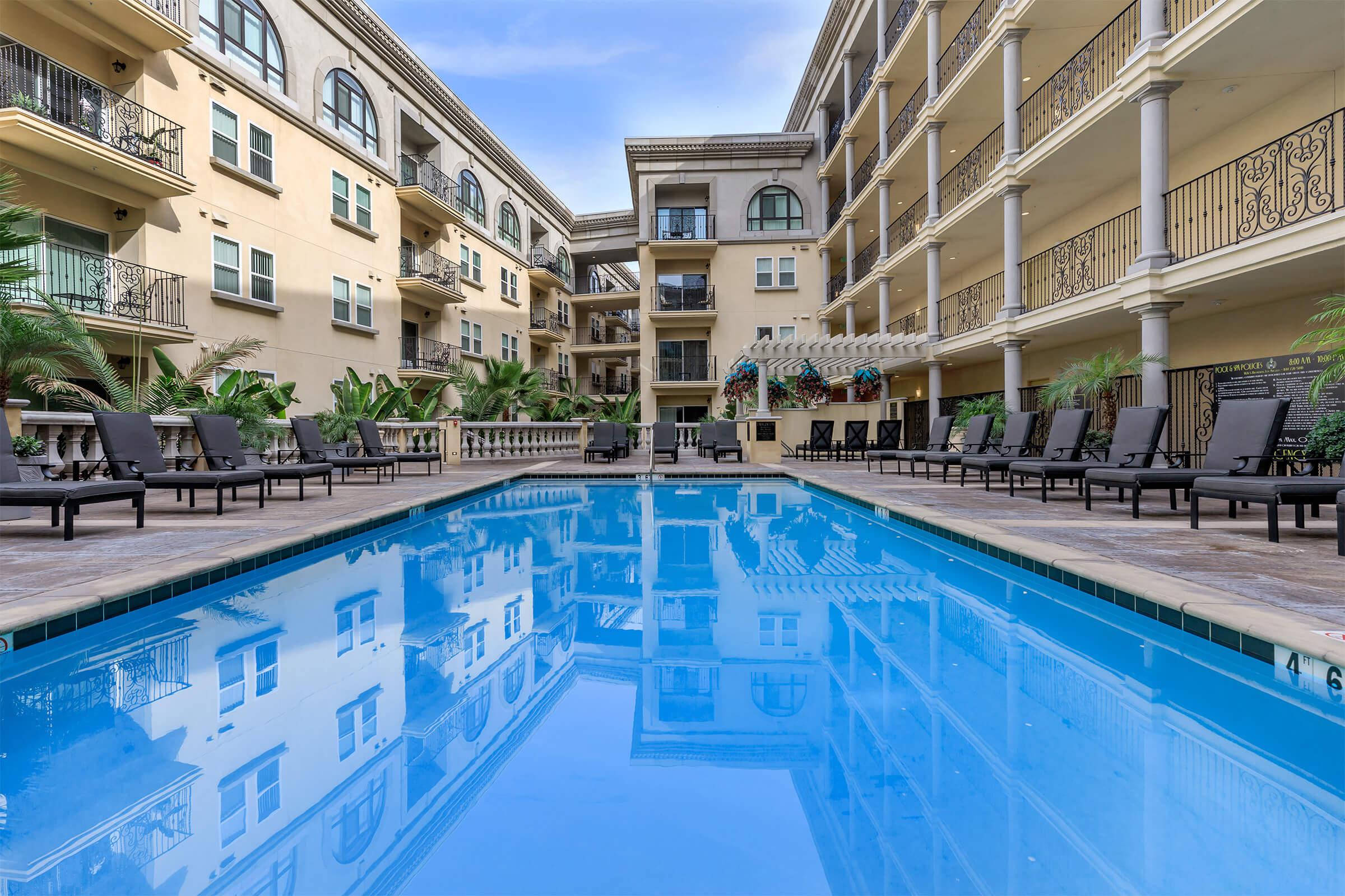 a pool in front of a building