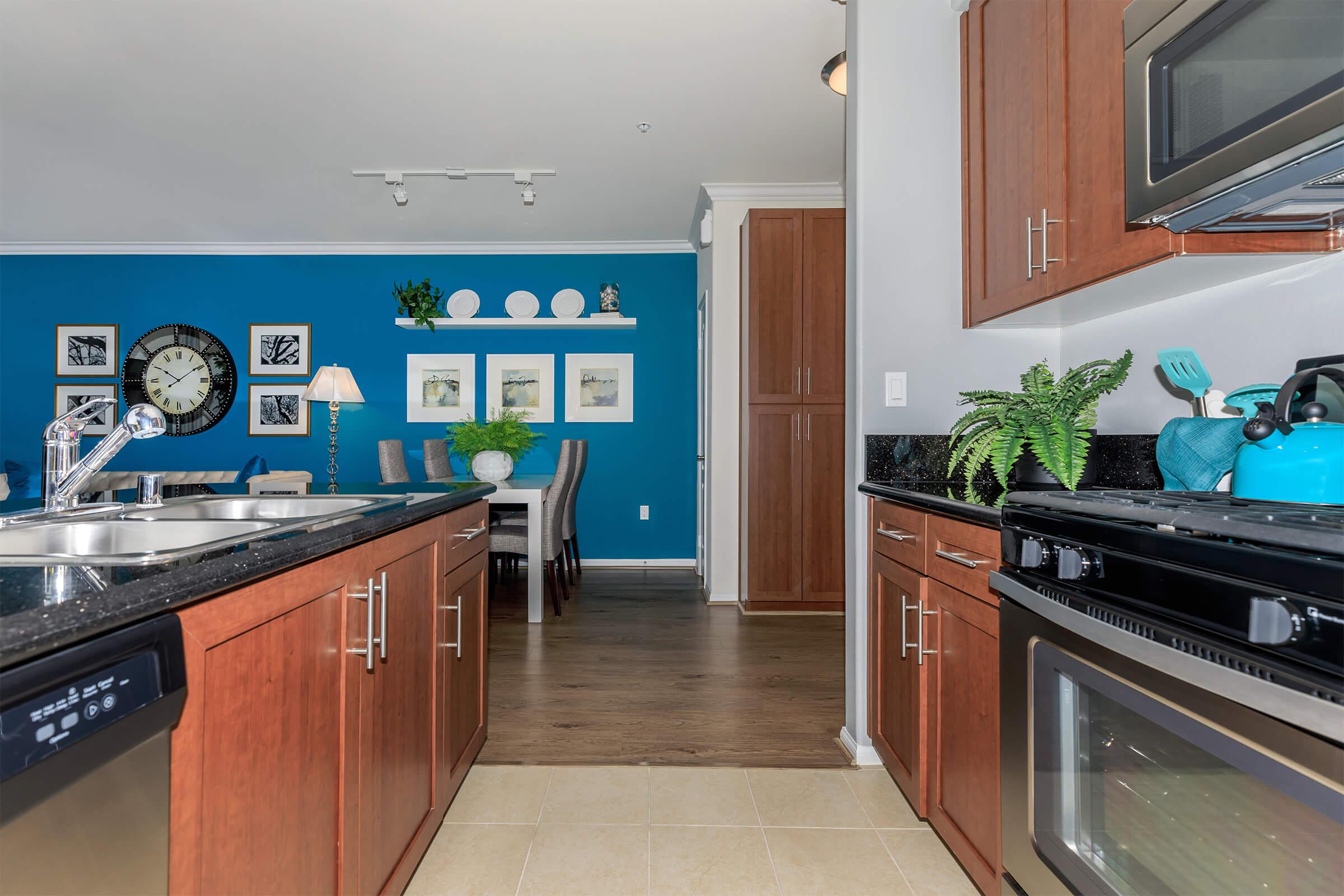 a large kitchen with stainless steel appliances