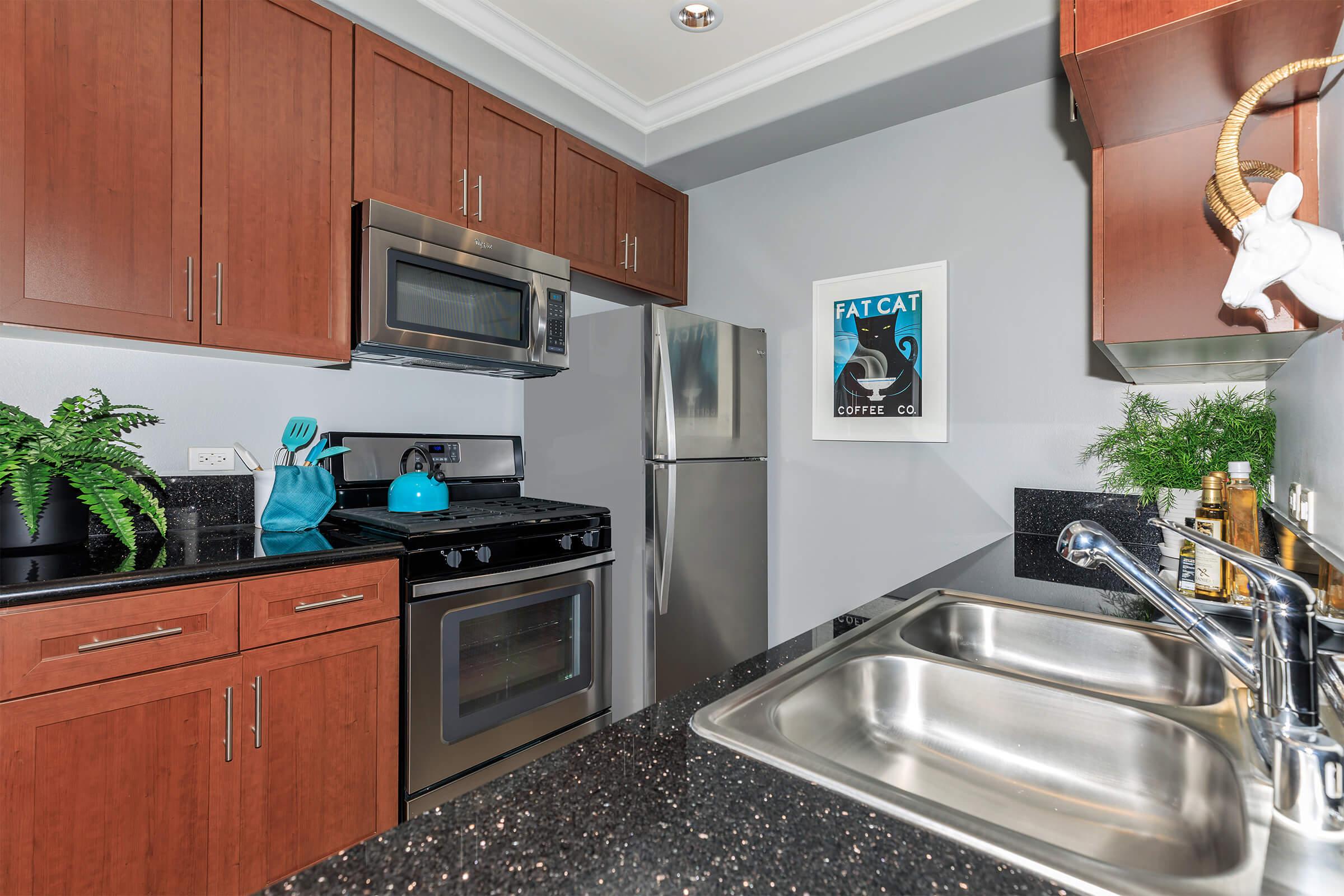 a modern kitchen with stainless steel appliances