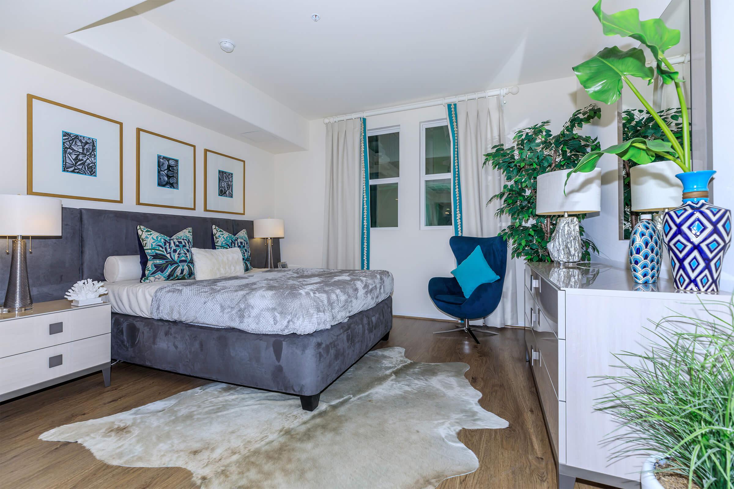 a living room filled with furniture and a large window