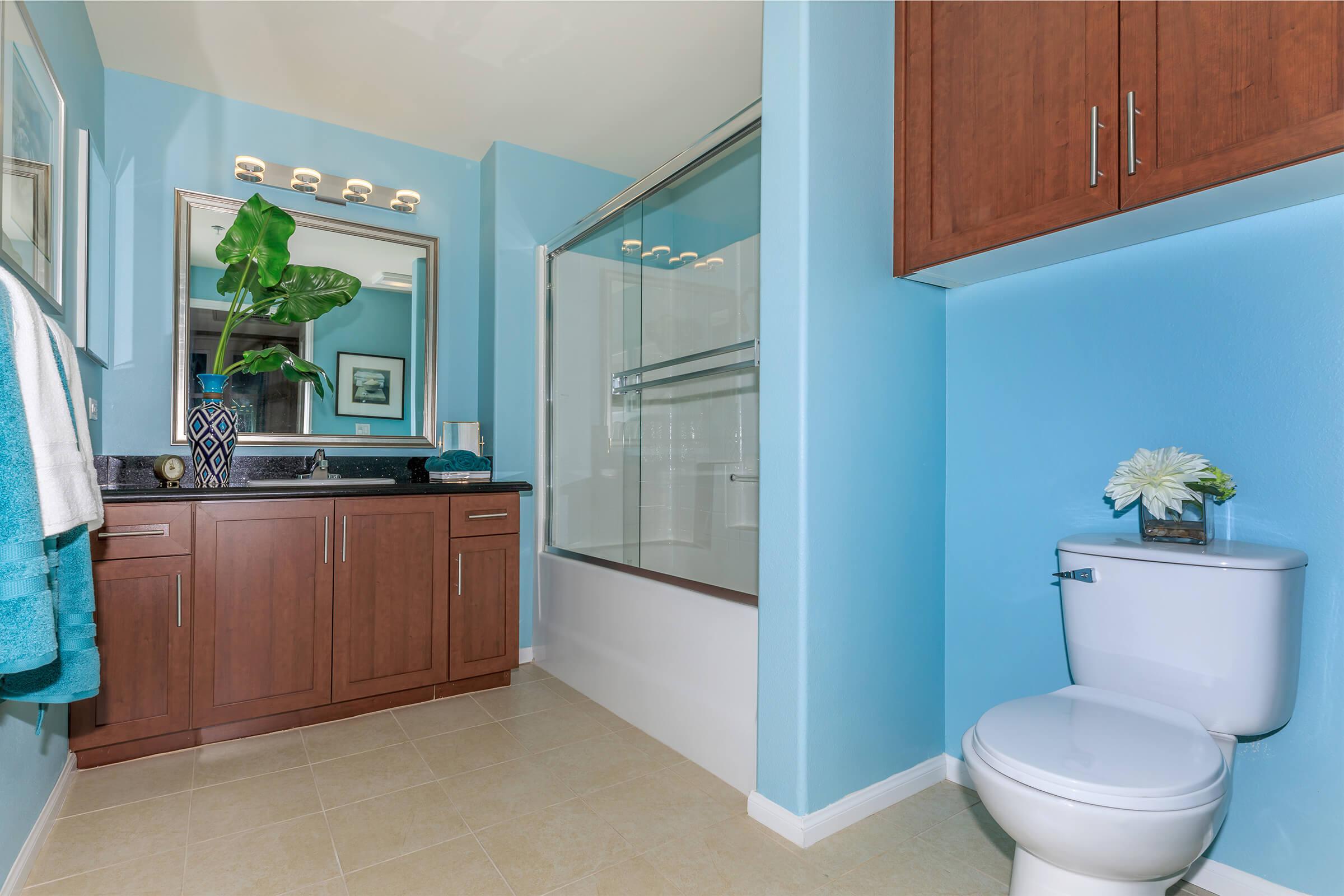 a kitchen with a sink and a mirror