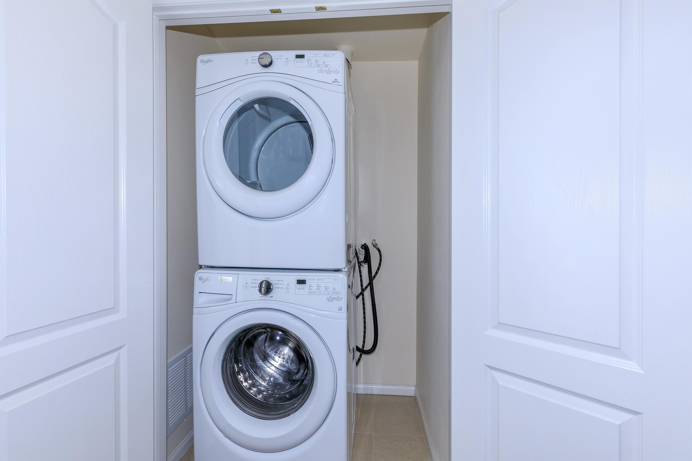 a microwave oven sitting on top of a refrigerator