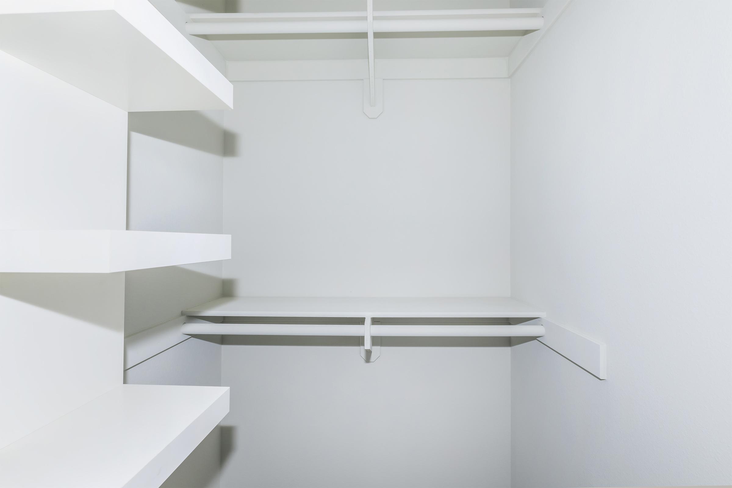 a white sink sitting next to a shower