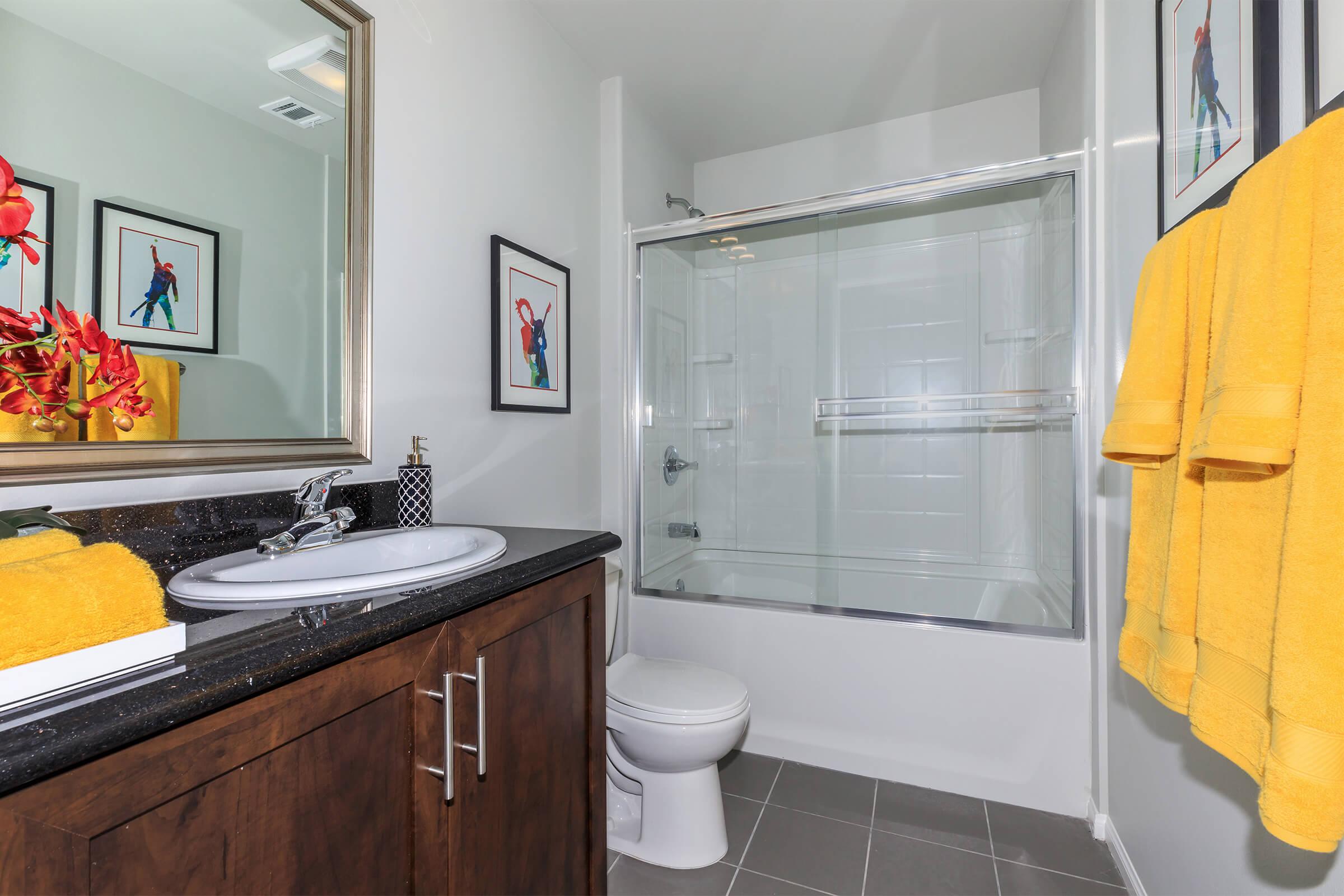 a kitchen with a sink and a mirror