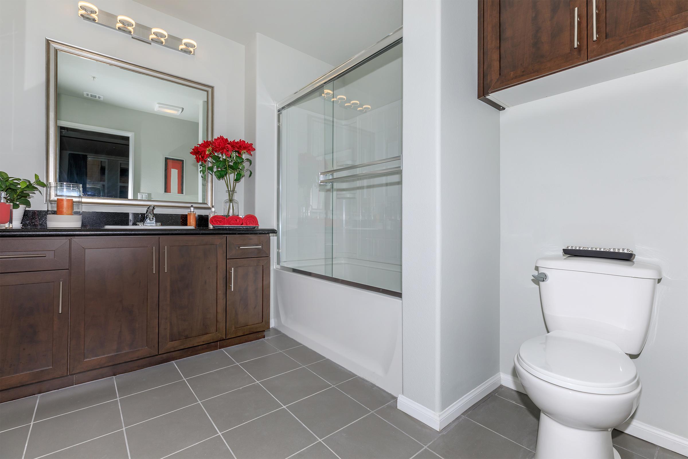 a kitchen with a sink and a mirror