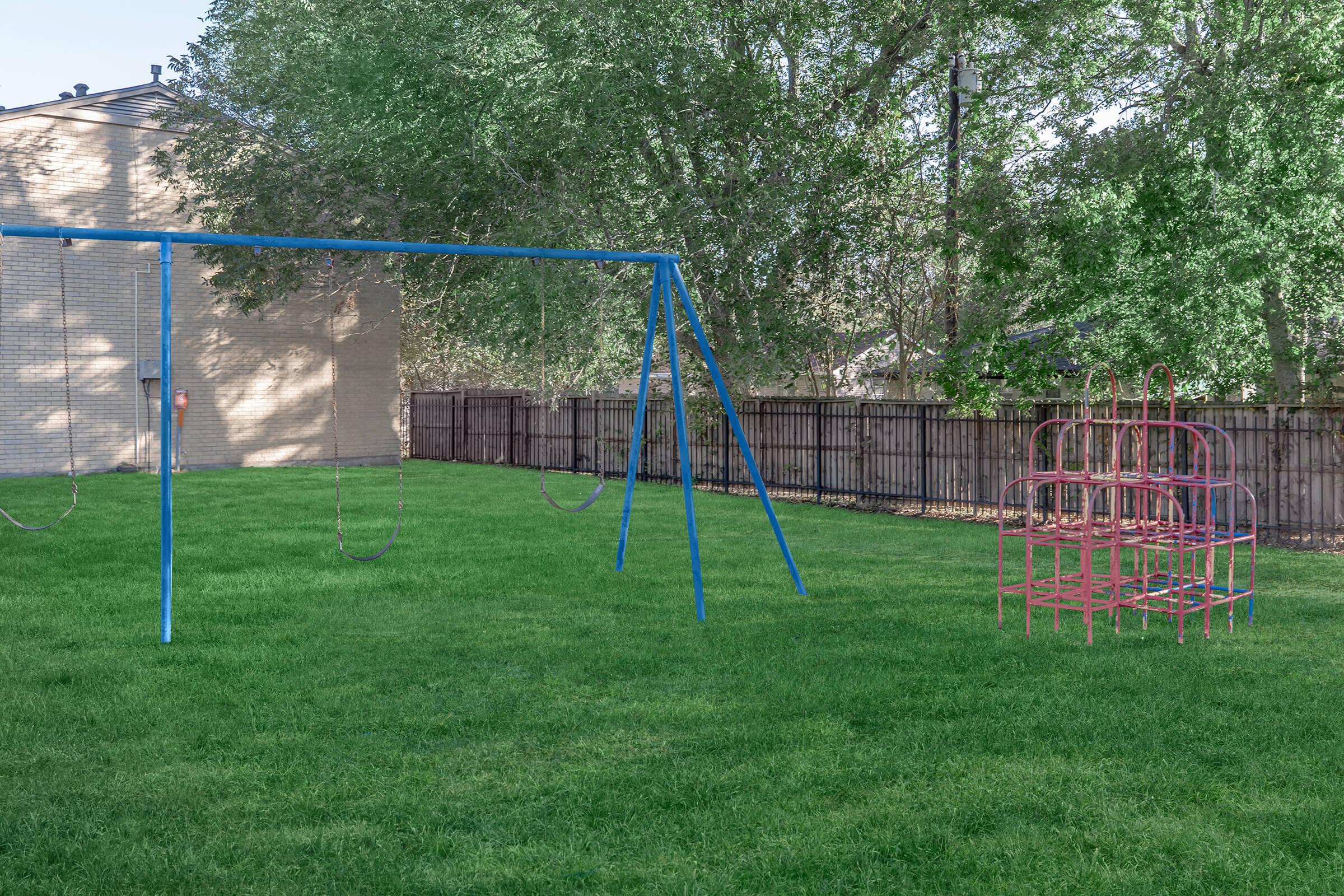 a playground with a blue ball on the field