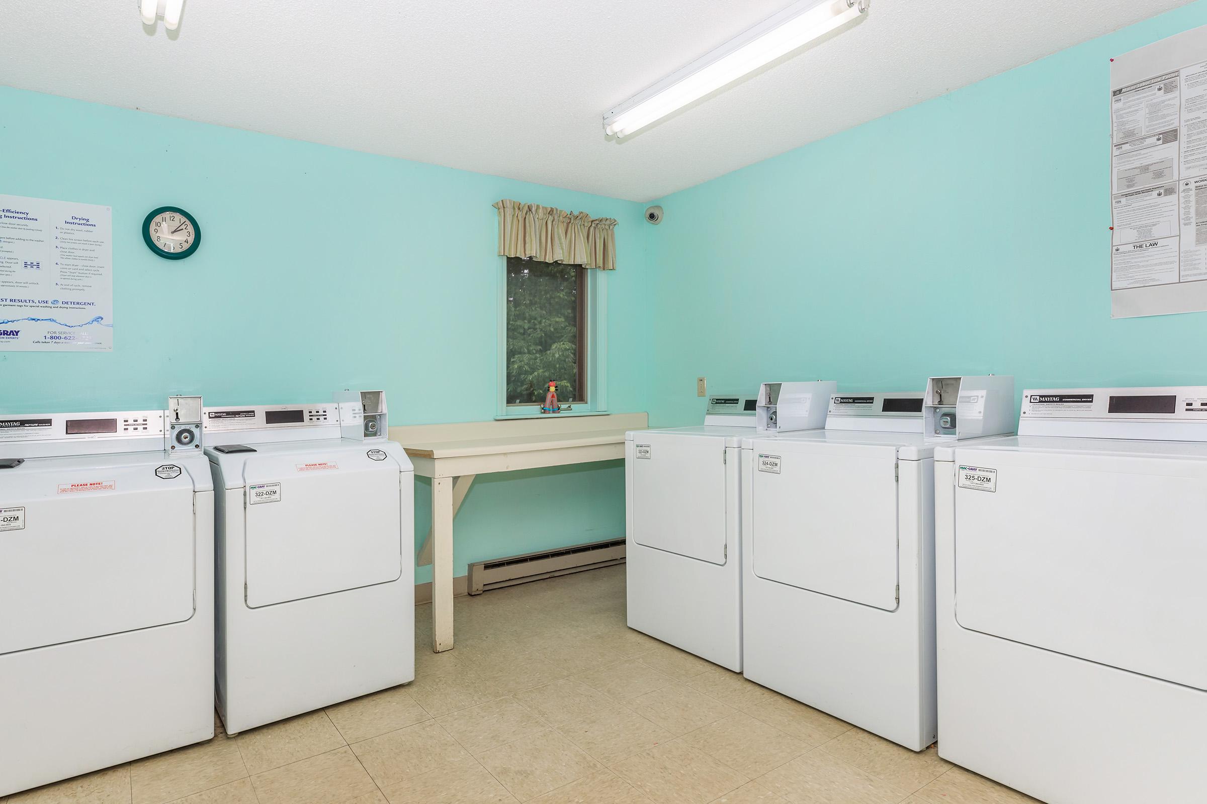 a white refrigerator freezer sitting in a room