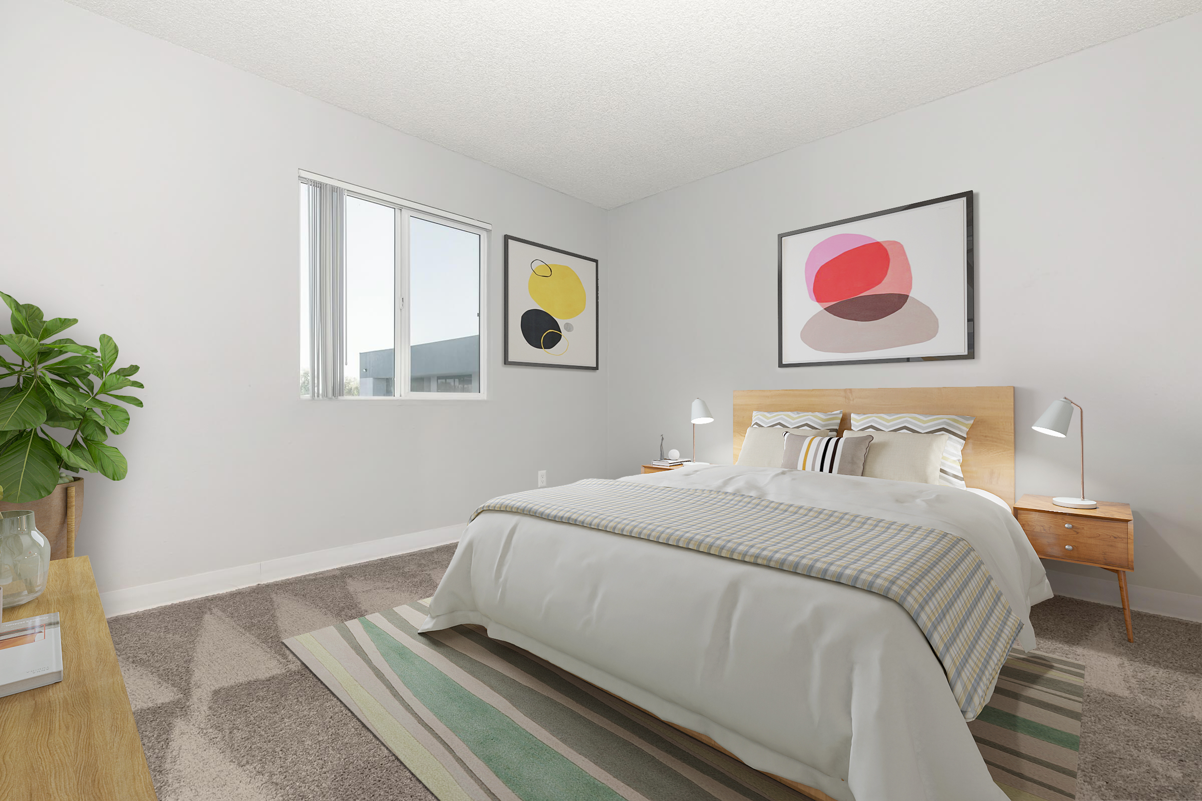 A brightly lit modern bedroom featuring a large bed with white bedding and decorative pillows. There are two bedside lamps on wooden nightstands. The walls are light gray, adorned with abstract art, and a vibrant rug lies underneath. A window allows natural light to enter, along with a green potted plant in the corner.