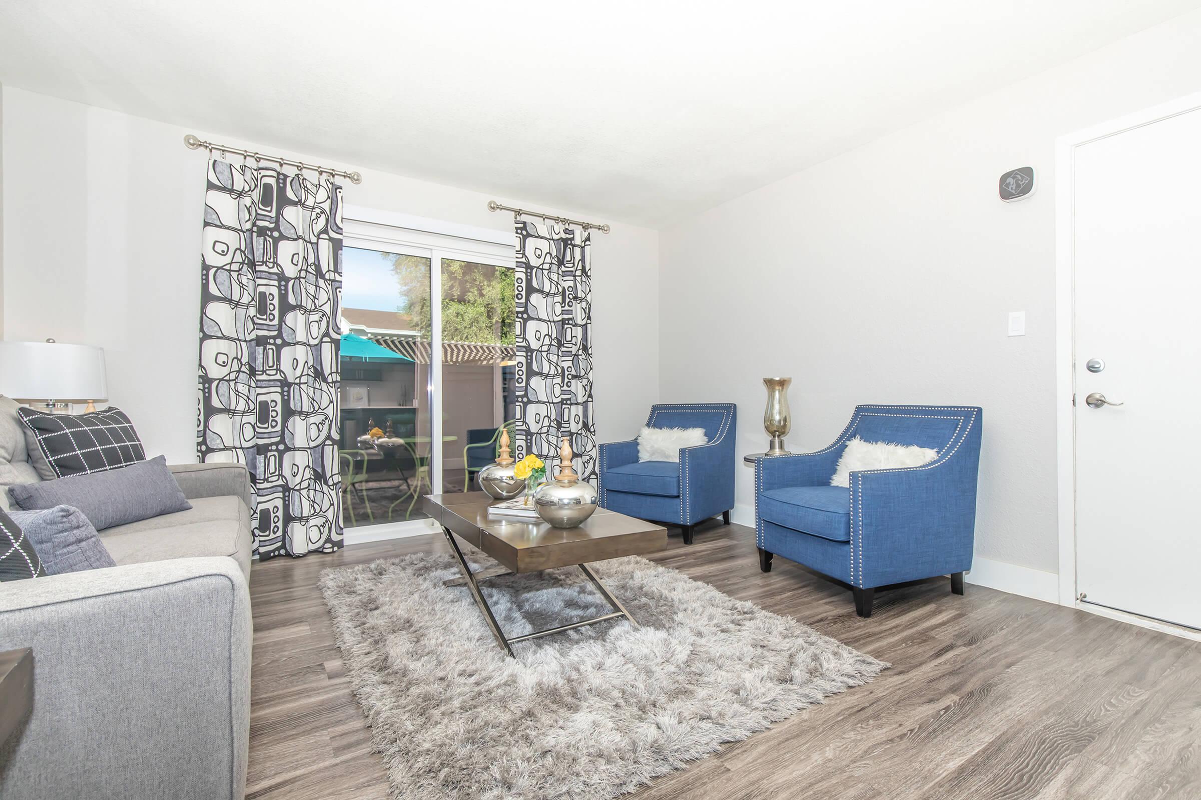 a living room filled with furniture and a tv