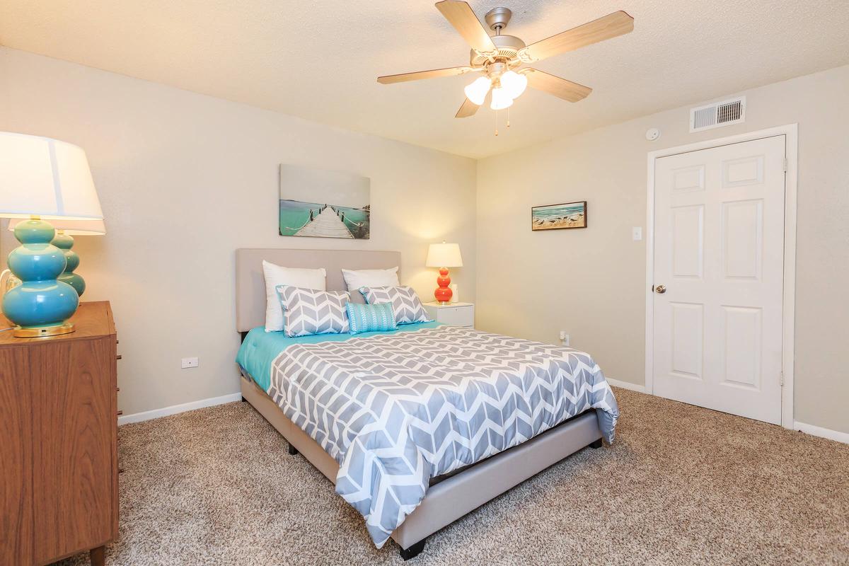 a bedroom with a bed in a room